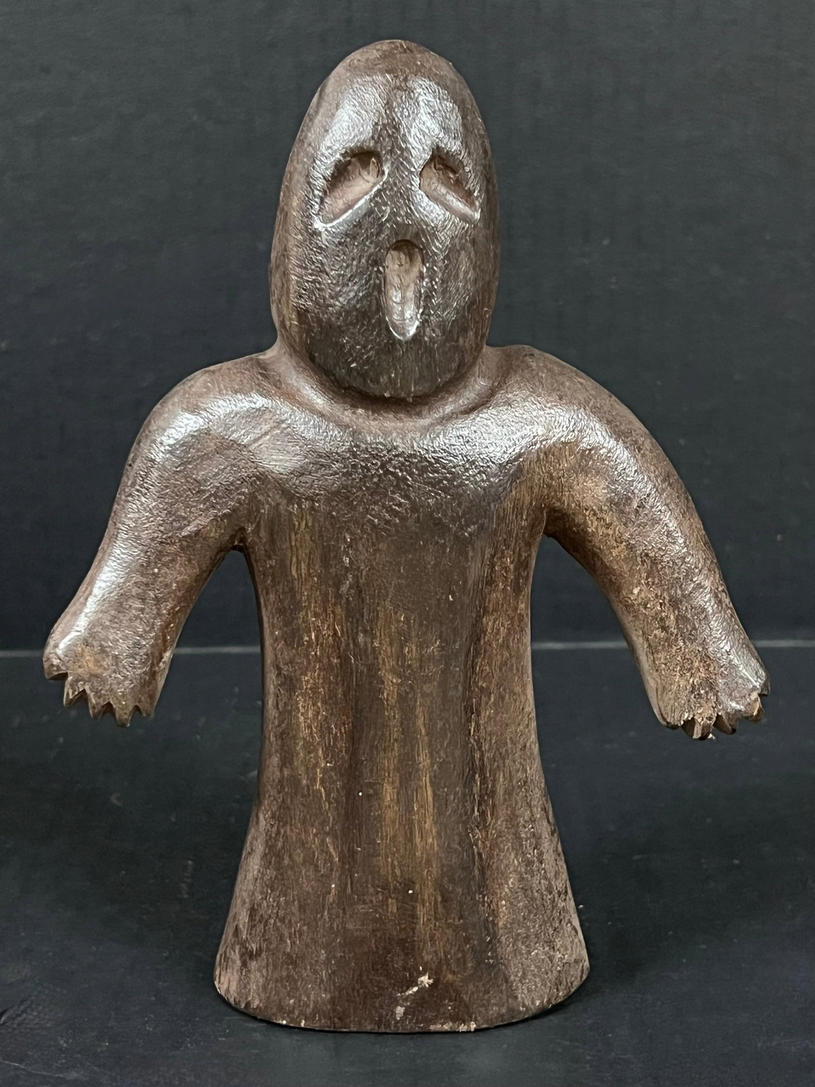 Carved Wood Ghost Sculpture: Folk Art Carved Wood Ghost Sculpture. The dimension is 8 inches high x 6 inches wide. Please be aware that some of the items are vintage, secondhand, old ages, antiques and may have a defects or sign