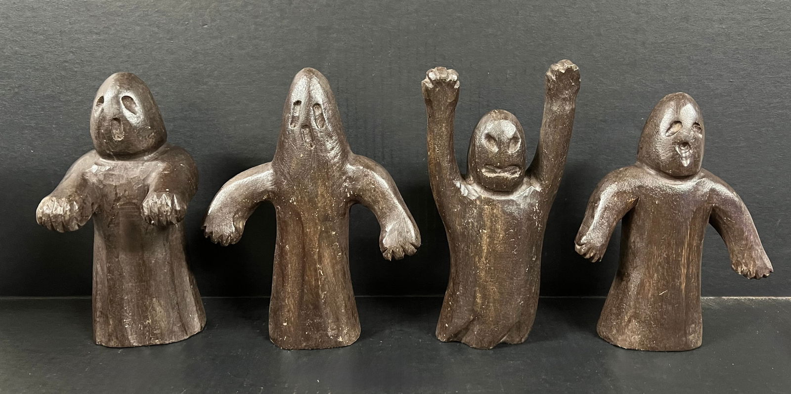 Carved Wood Set of Ghost Sculpture: Folk Art Carved Wood Set of Ghost Sculpture. The dimension is 9 inches high x 4 inches wide, 9 inches high x 7 inches wide, 8 inches high x 6 inches wide and 9 inches high x 4.5 inches wide. Please