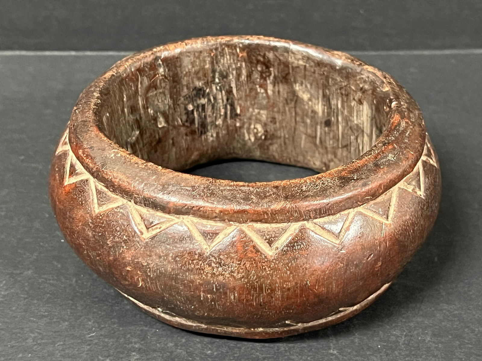 Carved Wood Nigerian Currency Bracelet: African Tribal Art Carved Wood Nigerian Currency Bracelet. The dimension is 5.5 inches high x 2.5 inches wide. Please be aware that some of the items are vintage, secondhand, old ages, antiques and