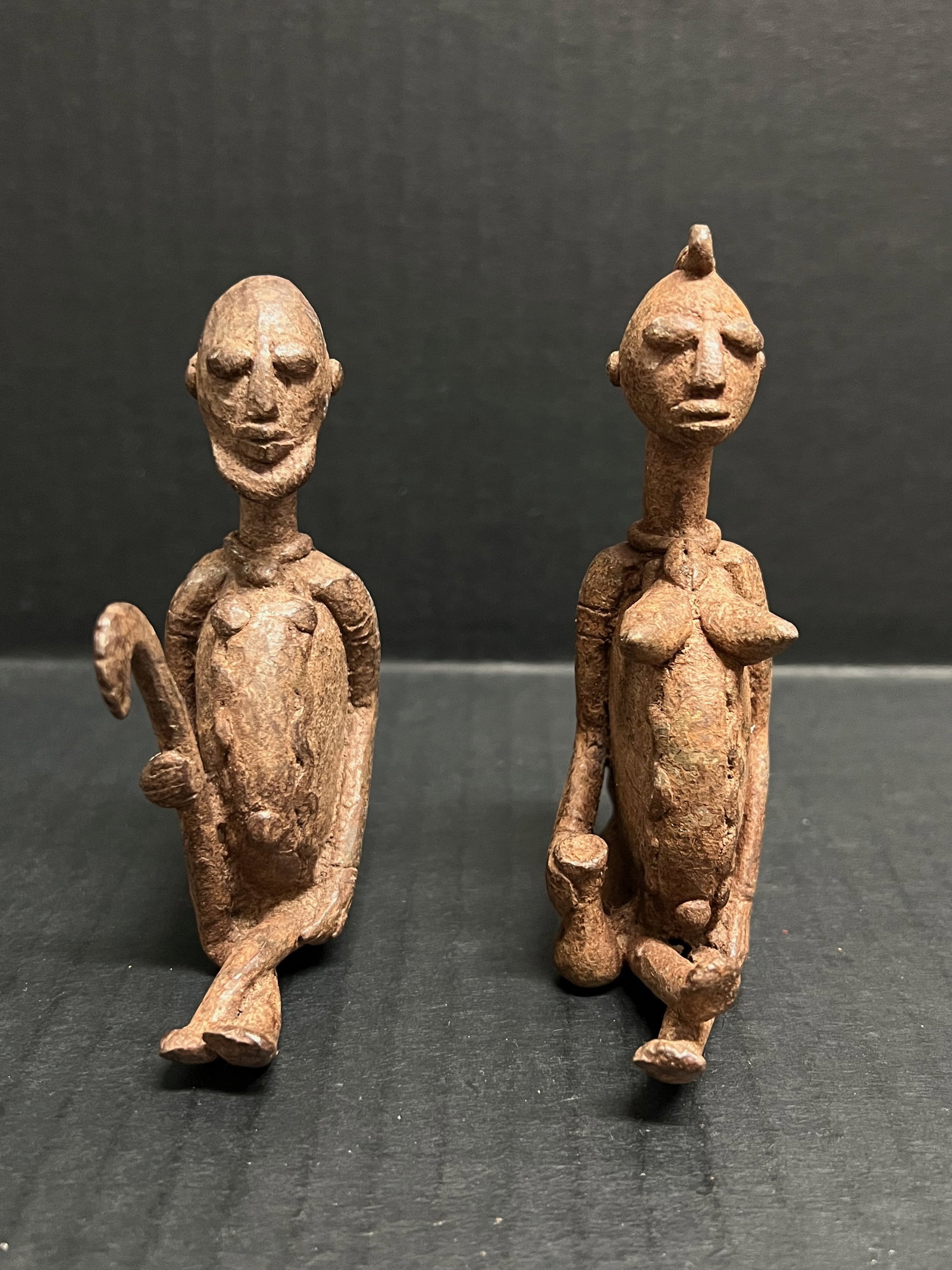 Pair of Dogon Bronze Statue: African Tribal Art Pair of Dogon Bronze Statue. The dimension is 3.75 inches high x 2.75 inches wide and 4.25 inches high x 2.75 inches wide. Please be aware that some of the items are vintage,