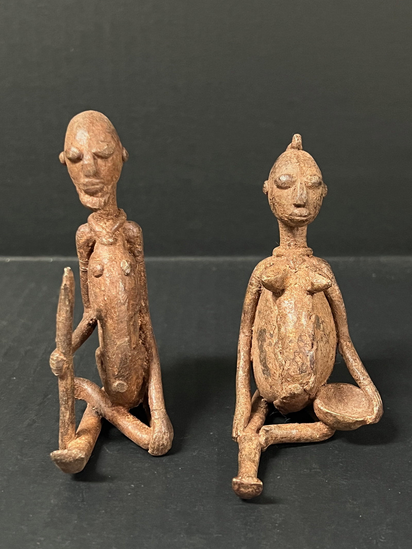 Pair of Dogon Bronze Statue: African Tribal Art Pair of Dogon Bronze Statue. The dimension is 4.25 inches high x 3 inches wide and 4 inches high x 3.25 inches wide. Please be aware that some of the items are vintage, secondhand,