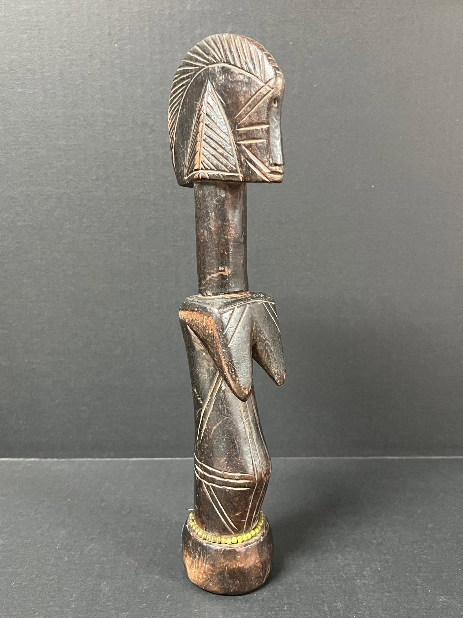 Mossi Fertility Doll: African Tribal Art Mossi Fertility Doll. The dimension is 13 inches high x 3.5 inches wide. Please be aware that some of the items are vintage, secondhand, old ages, antiques and may have a defects