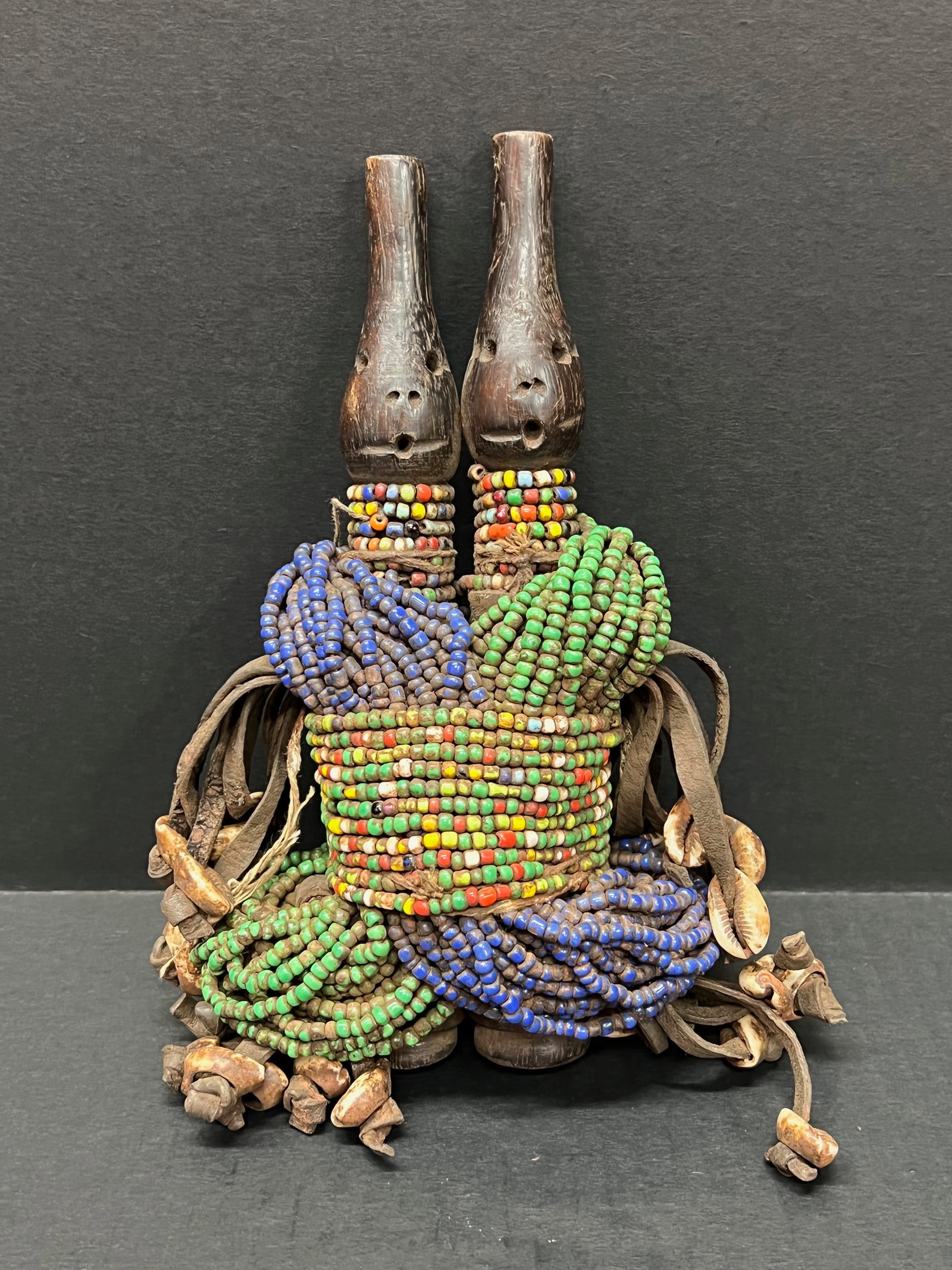 Namji Beaded Doll Statue: African Tribal Art Namji Beaded Doll Statue. The dimension is 9 inches high x 5 inches wide. Please be aware that some of the items are vintage, secondhand, old ages, antiques and may have a defects