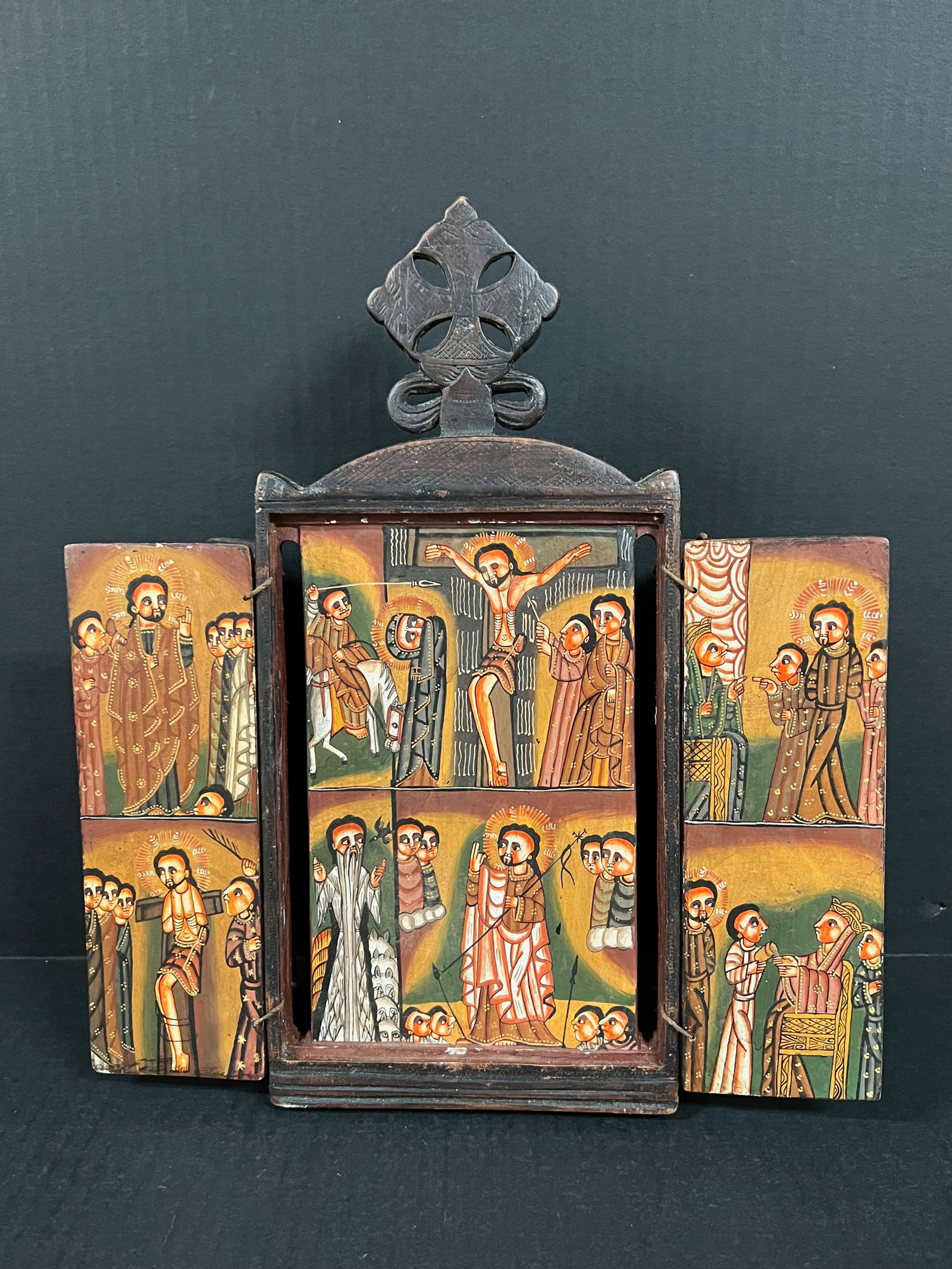 Ethiopian Coptic Triptych Icon: African Tribal Art Ethiopian Coptic Triptych Icon. The dimension is 13 inches high x 11.5 inches wide. Please be aware that some of the items are vintage, secondhand, old ages, antiques and may have