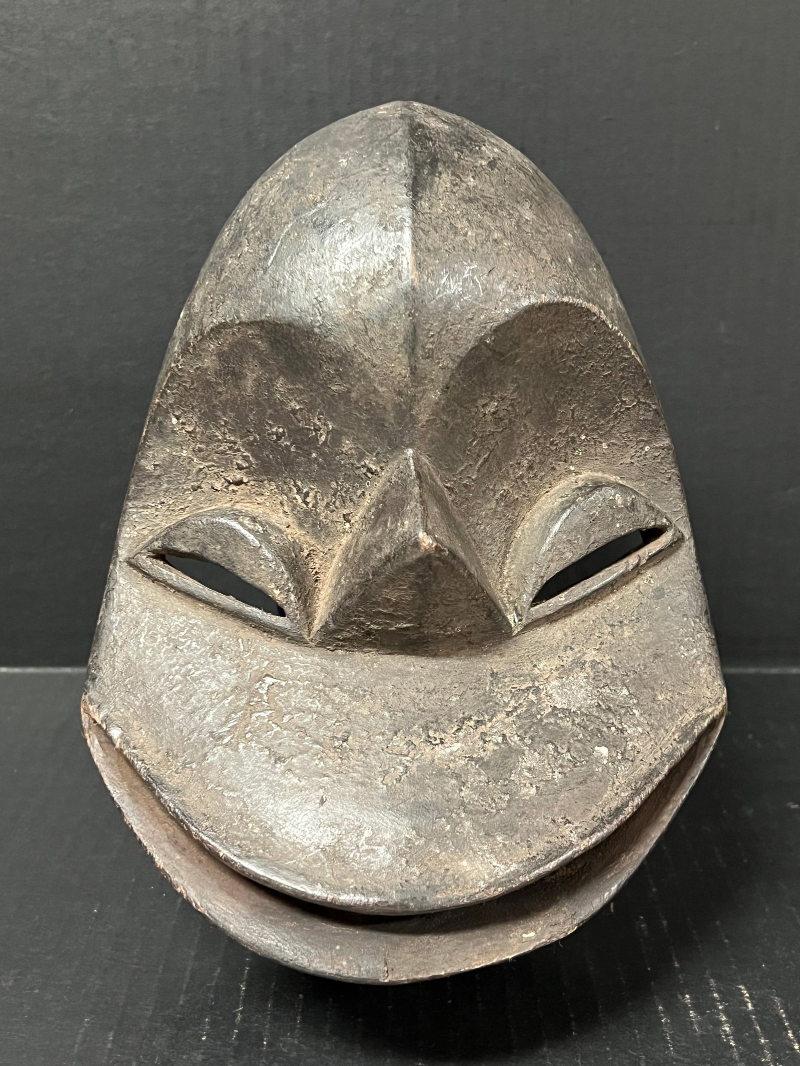 Hemba Mask: African Tribal Art Hemba Mask. The dimension is 10 inches high x 7 inches wide. Please be aware that some of the items are vintage, secondhand, old ages, antiques and may have a defects or sign of