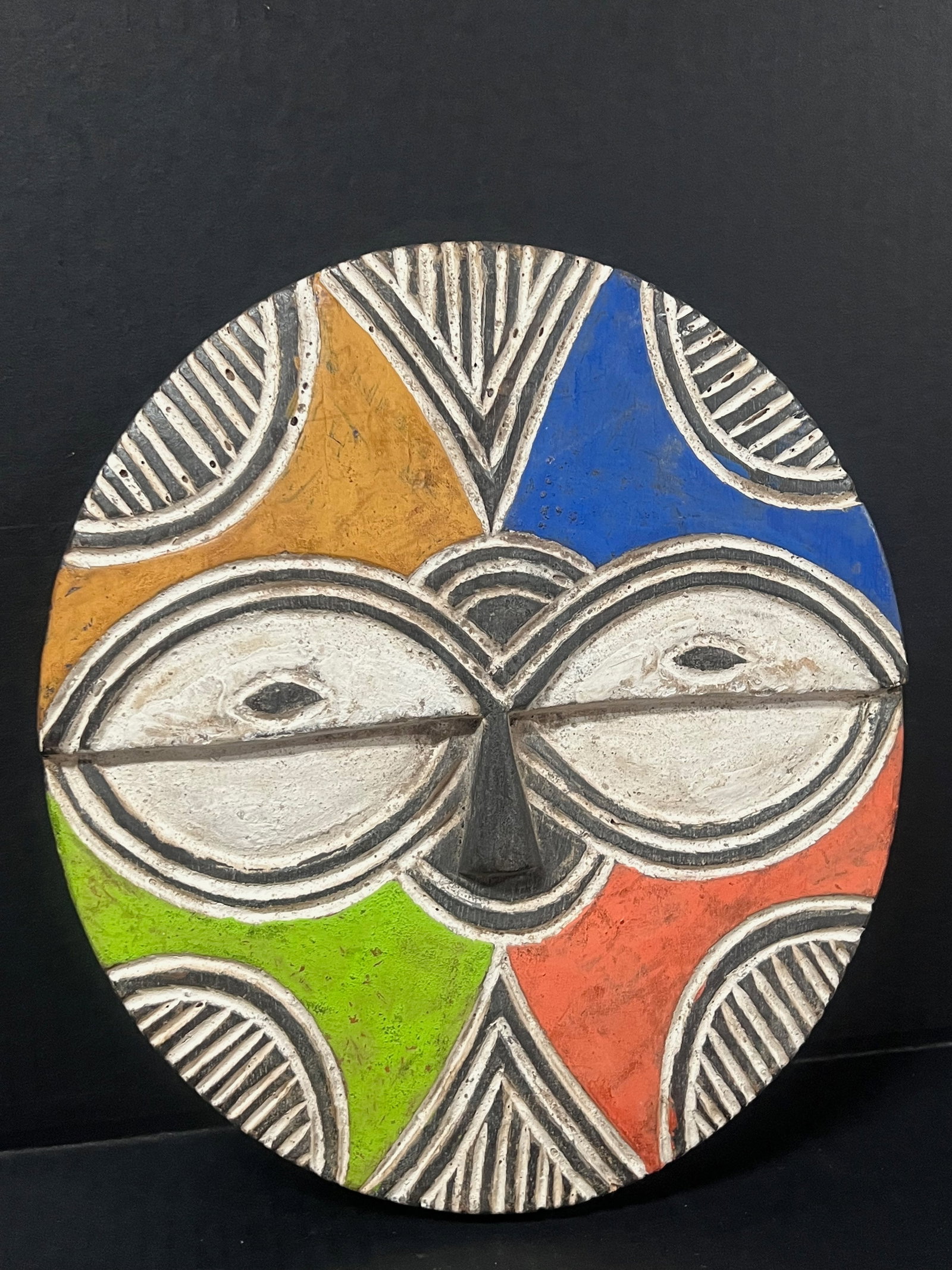 Teke Mask: African Tribal Art Teke Mask. The dimension is 11.5 inches high x 10.5 inches wide. Please be aware that some of the items are vintage, secondhand, old ages, antiques and may have a defects or sign