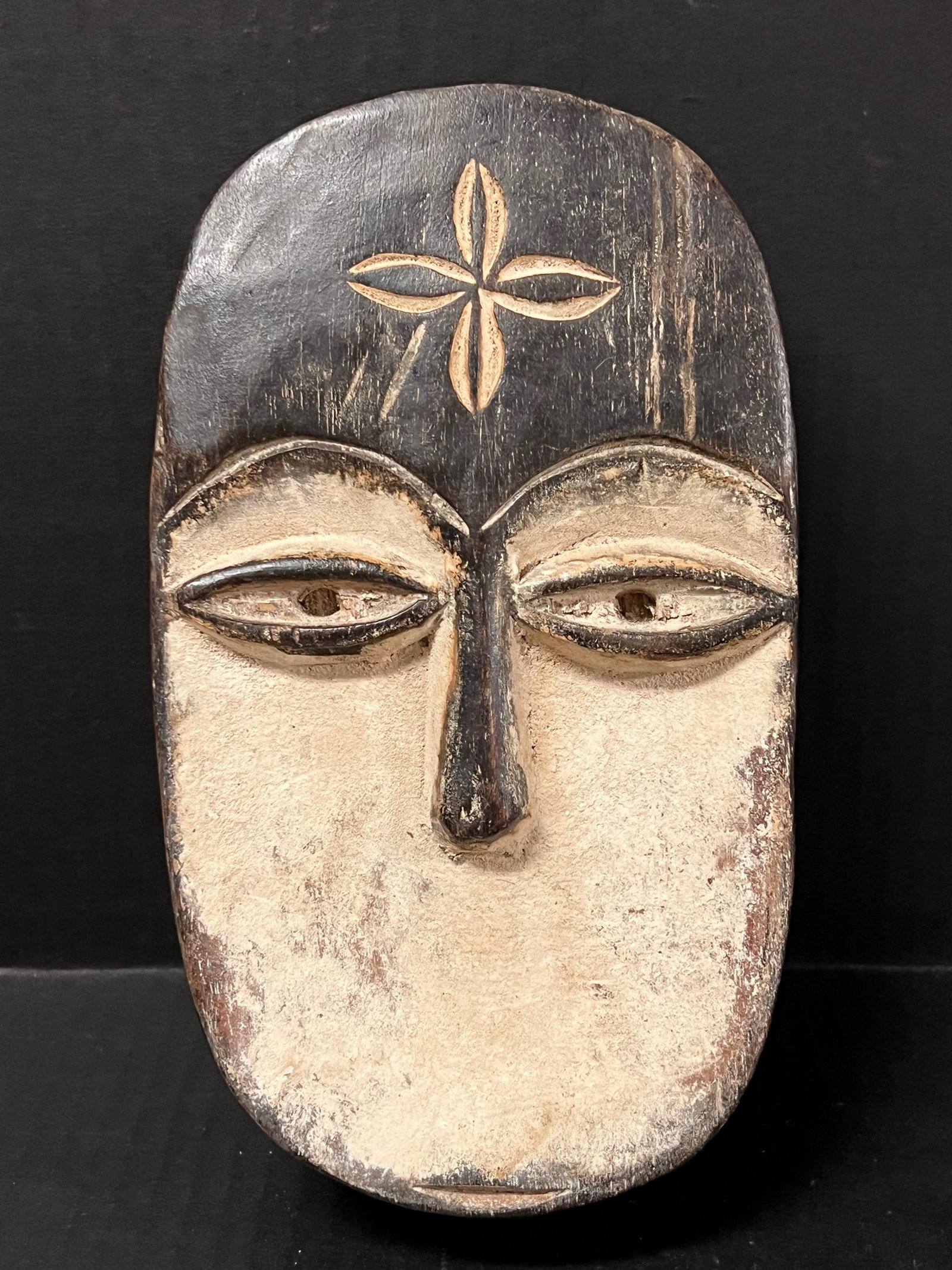 Kwele Mask: African Tribal Art Kwele Mask. The dimension is 9 inches high x 5 inches wide. Please be aware that some of the items are vintage, secondhand, old ages, antiques and may have a defects or sign of