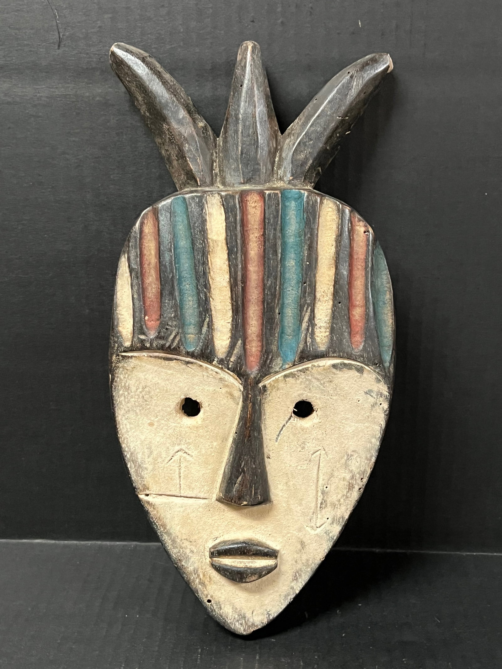 Vuvi Mask: African Tribal Art Vuvi Mask. The dimension is 13 inches high x 6.25 inches wide. Please be aware that some of the items are vintage, secondhand, old ages, antiques and may have a defects or sign of