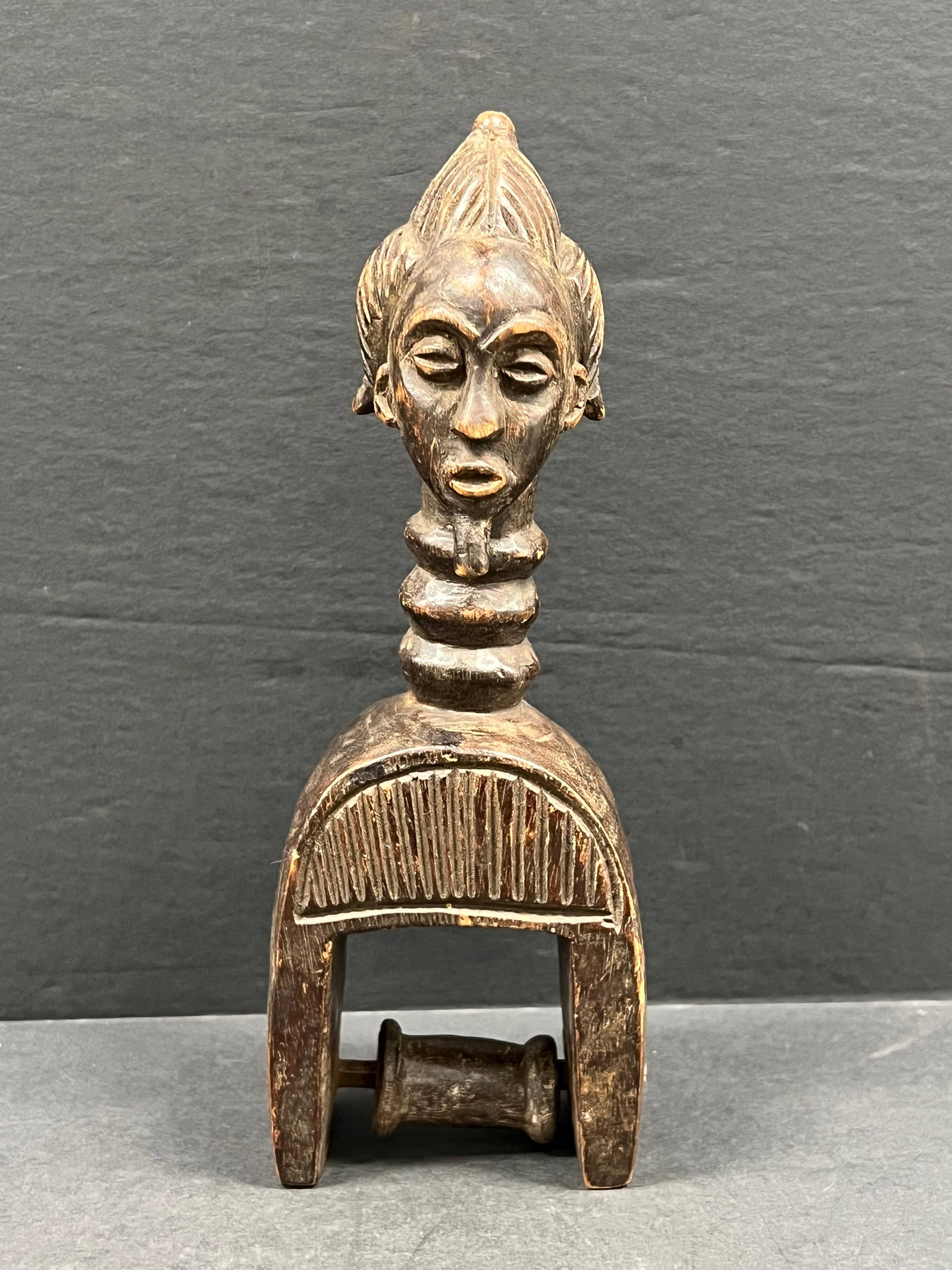 Baule Pulley: African Tribal Art Baule Pulley. The dimension is 9.25 inches high x 3 inches wide. Please be aware that some of the items are vintage, secondhand, old ages, antiques and may have a defects or sign
