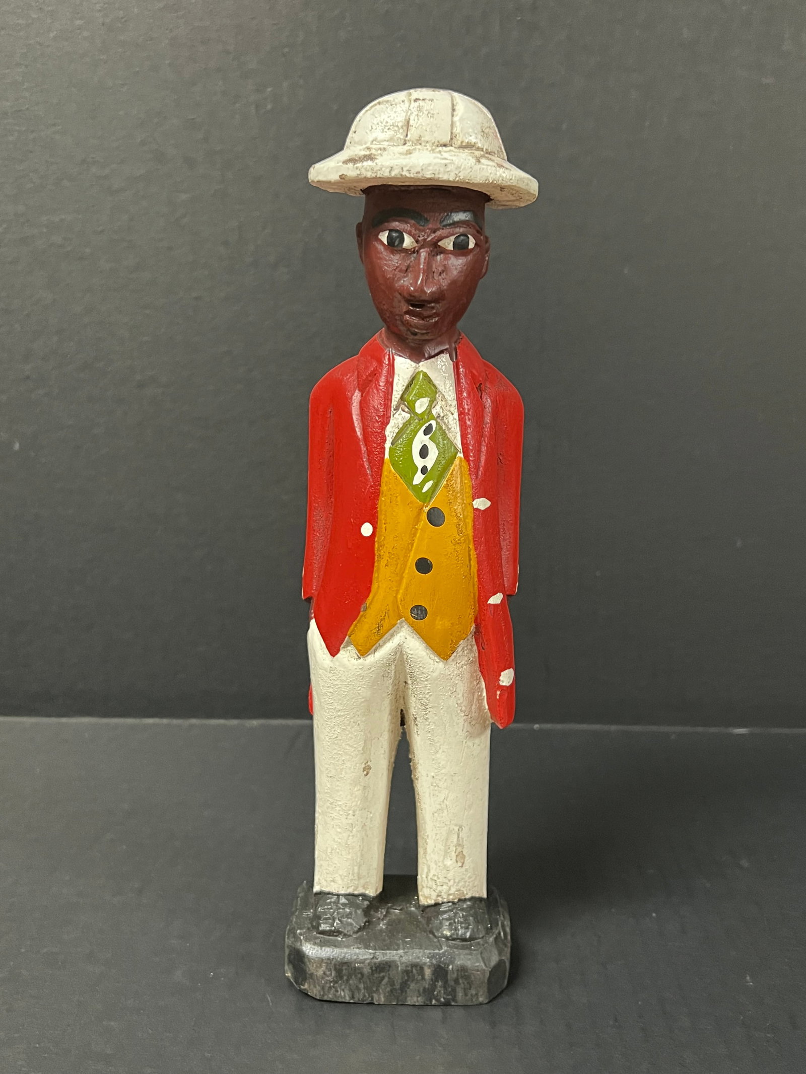 Colonial Statue: African Tribal Art Colonial Statue. The dimension is 11.5 inches high x 2.75 inches wide. Please be aware that some of the items are vintage, secondhand, old ages, antiques and may have a defects or s