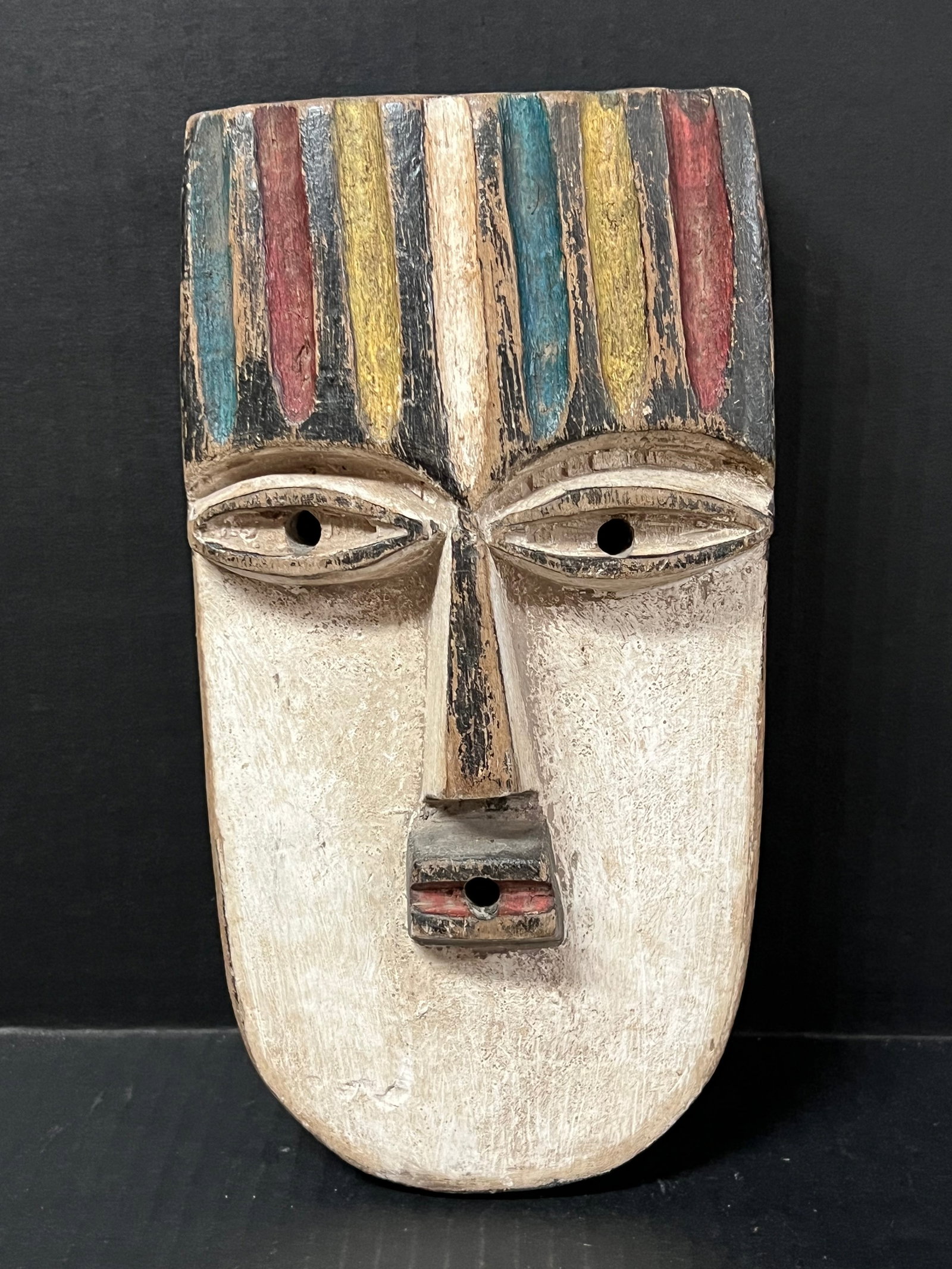 Vuvi Mask: African Tribal Art Vuvi Mask. The dimension is 10 inches high x 5.25 inches wide. Please be aware that some of the items are vintage, secondhand, old ages, antiques and may have a defects or sign of