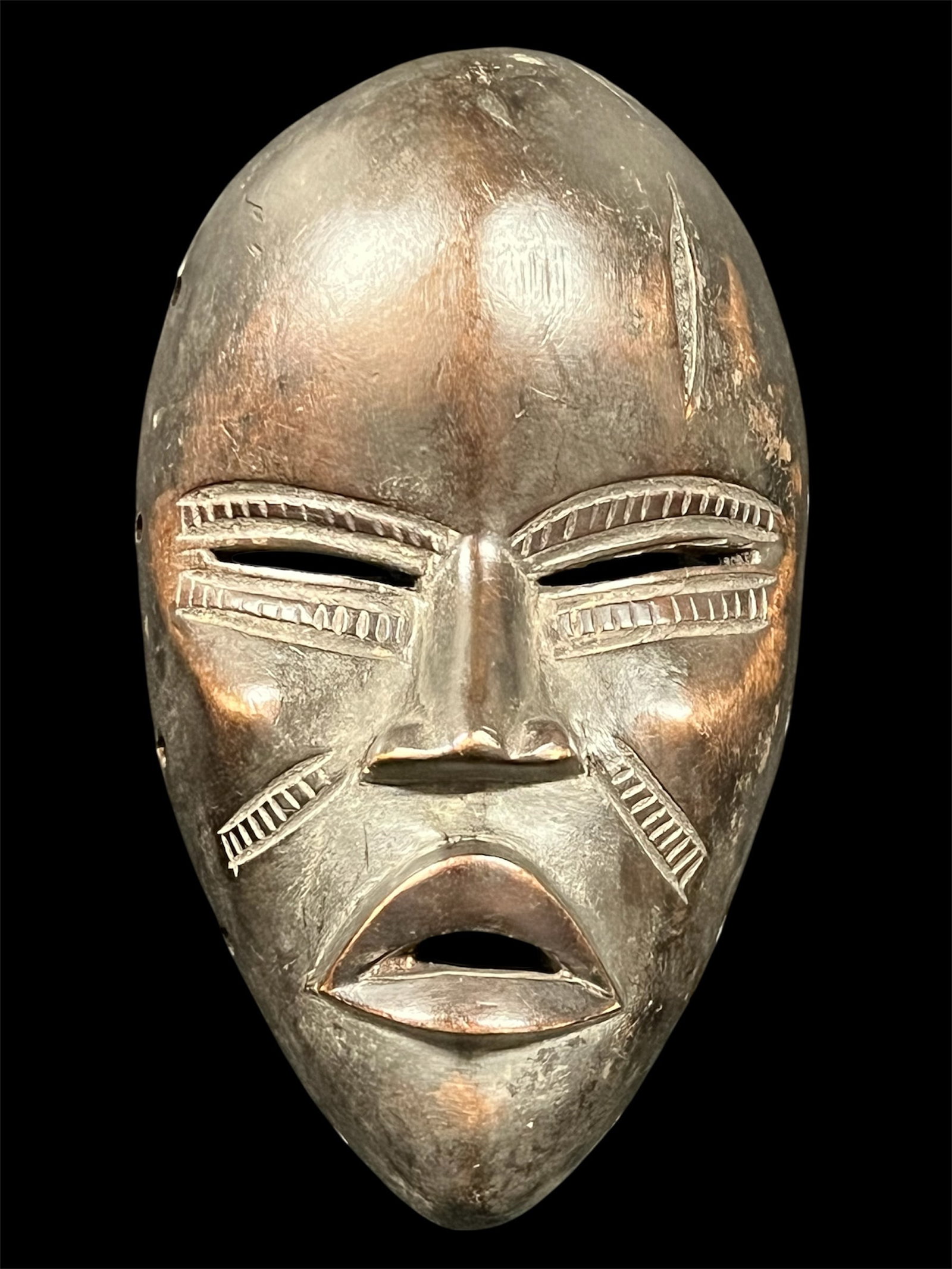 Dan Mask: African Tribal Art Carved Wood Dan Mask. The dimension is 8.75 inches high x 5 inches wide. Please be aware that some of the items are vintage, secondhand, old ages, antiques and may have a defects