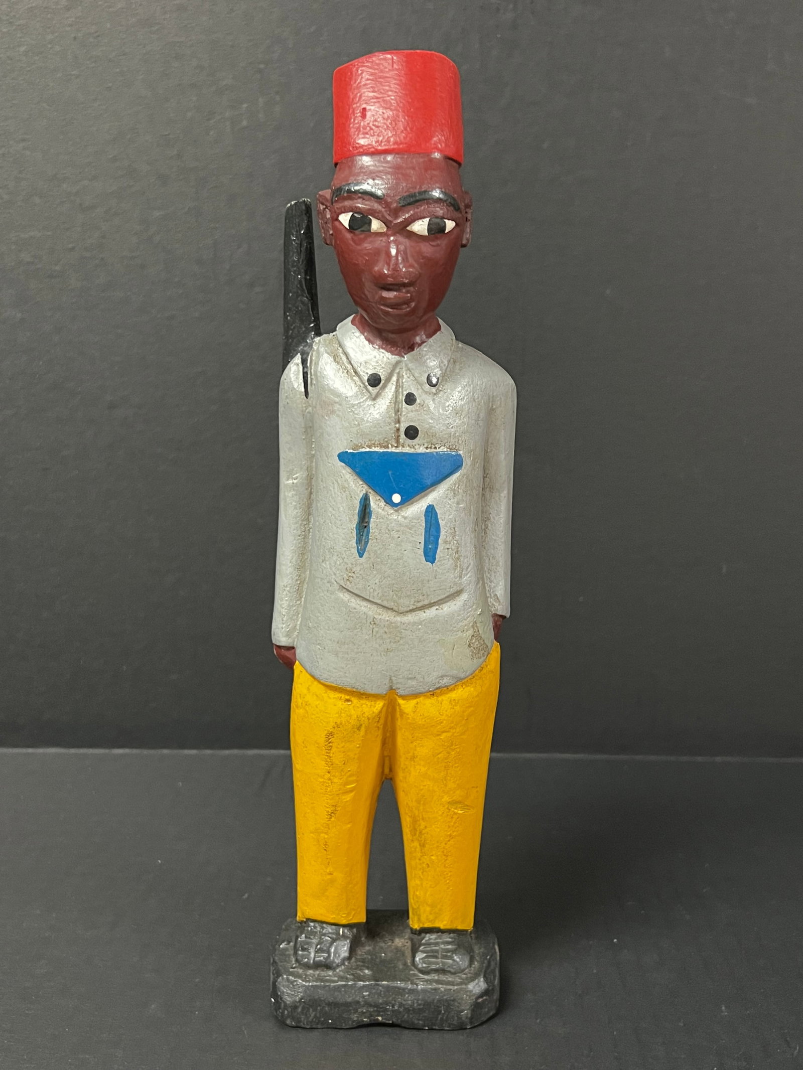 Colonial Statue: African Tribal Art Colonial Statue. The dimension is 12.5 inches high x 3 inches wide. Please be aware that some of the items are vintage, secondhand, old ages, antiques and may have a defects or