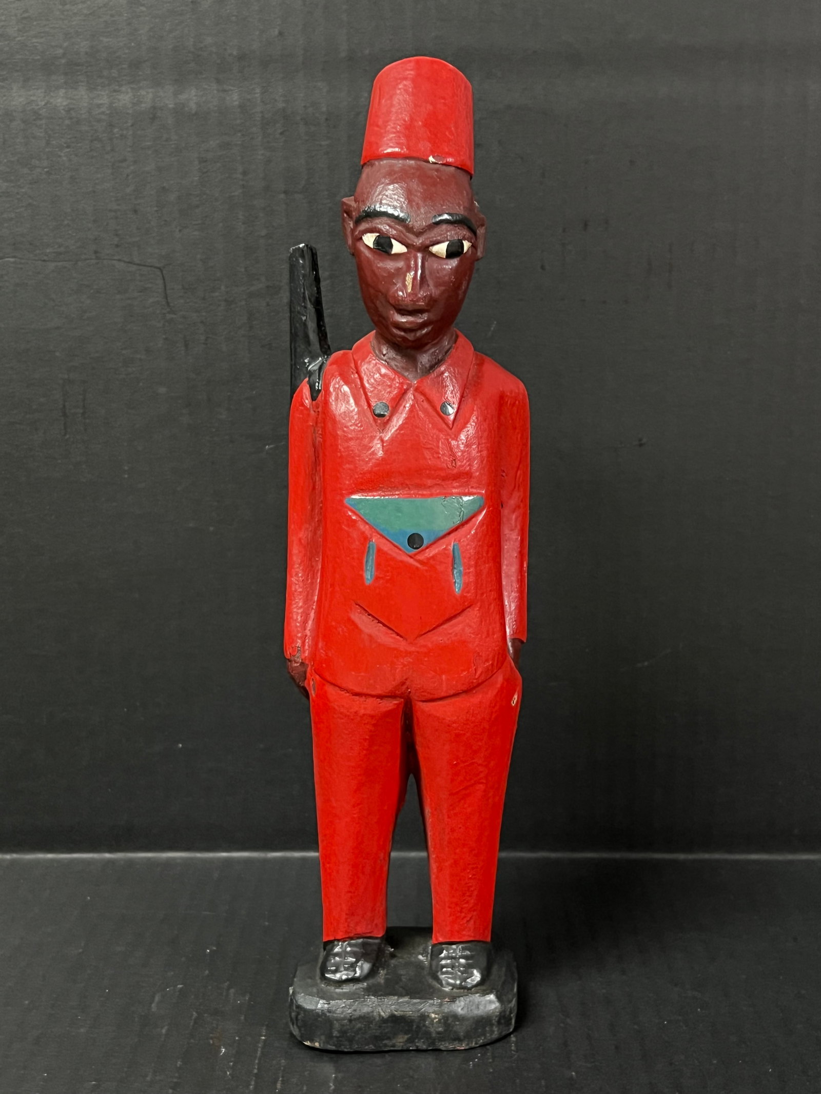 Colonial Statue: African Tribal Art Colonial Statue. The dimension is 12 inches high x 3 inches wide. Please be aware that some of the items are vintage, secondhand, old ages, antiques and may have a defects or sign