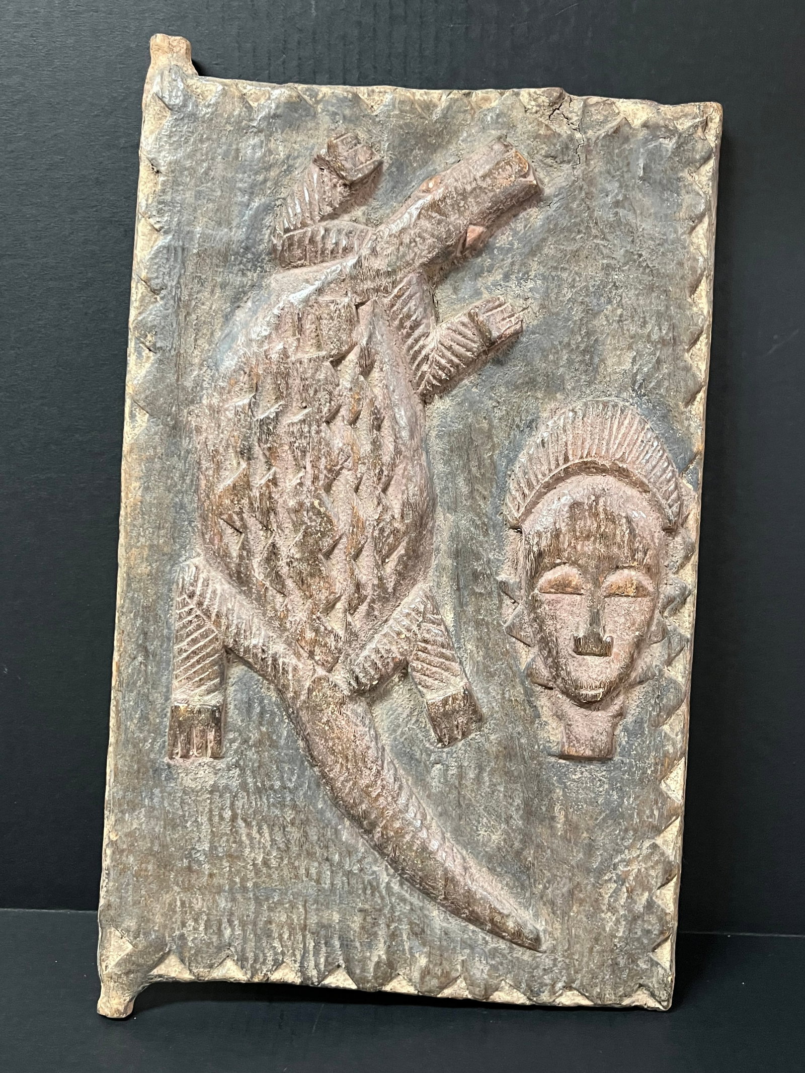 Baule Door: African Tribal Art Baule Door. The dimension is 20 inches high x 12 inches wide. Please be aware that some of the items are vintage, secondhand, old ages, antiques and may have a defects or sign of ag