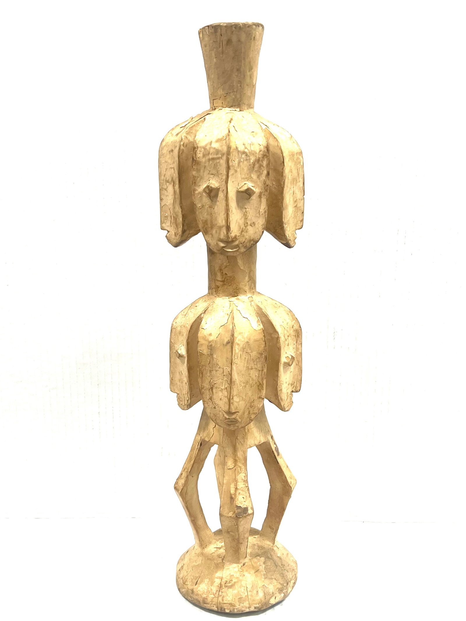 Lega Statue: African Tribal Art Lega Statue. The dimension is 22 inches high x 5.5 inches wide. Please be aware that some of the items are vintage, secondhand, old ages, antiques and may have a defects or sign of