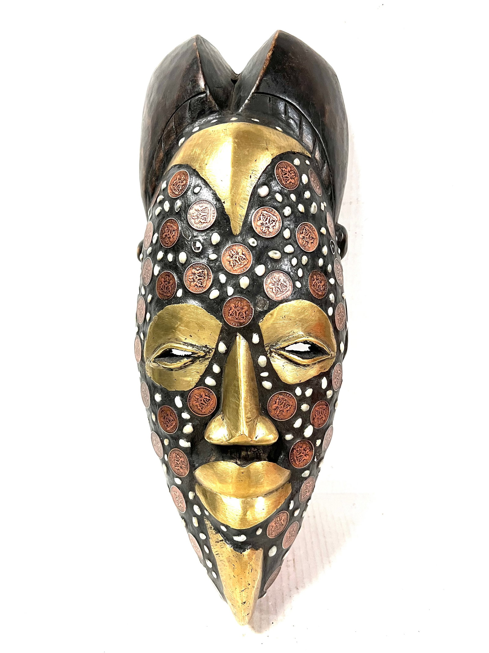 Tikar Mask: African Tribal Art Tikar Mask. The dimension is 19.5 inches high x 7.5 inches wide. Please be aware that some of the items are vintage, secondhand, old ages, antiques and may have a defects or sign