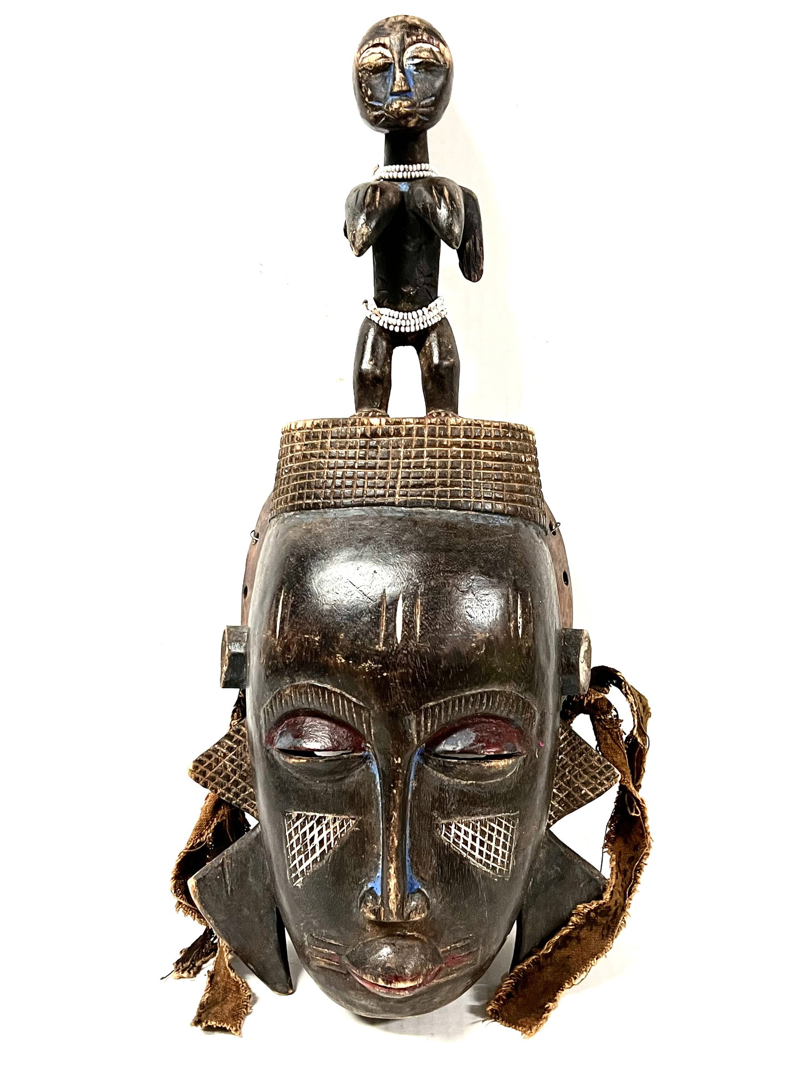 Kulango Mask: African Tribal Art Kulango Mask. The dimension is 17 inches high x 7.5 inches wide. Please be aware that some of the items are vintage, secondhand, old ages, antiques and may have a defects or sign