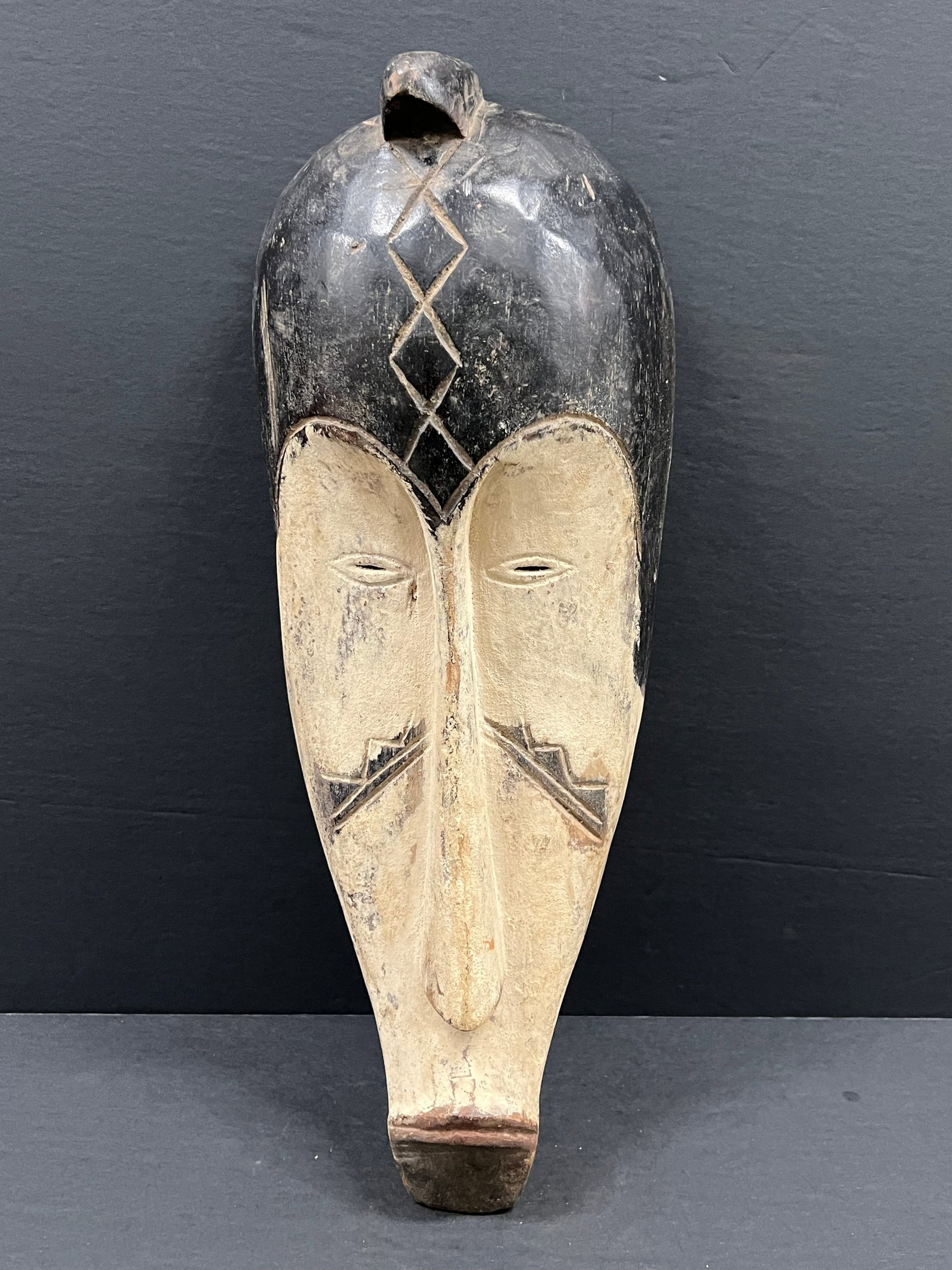 Fang Mask: African Tribal Art Fang Mask. The dimension is 20 inches high x 8 inches wide. Please be aware that some of the items are vintage, secondhand, old ages, antiques and may have a defects or sign of