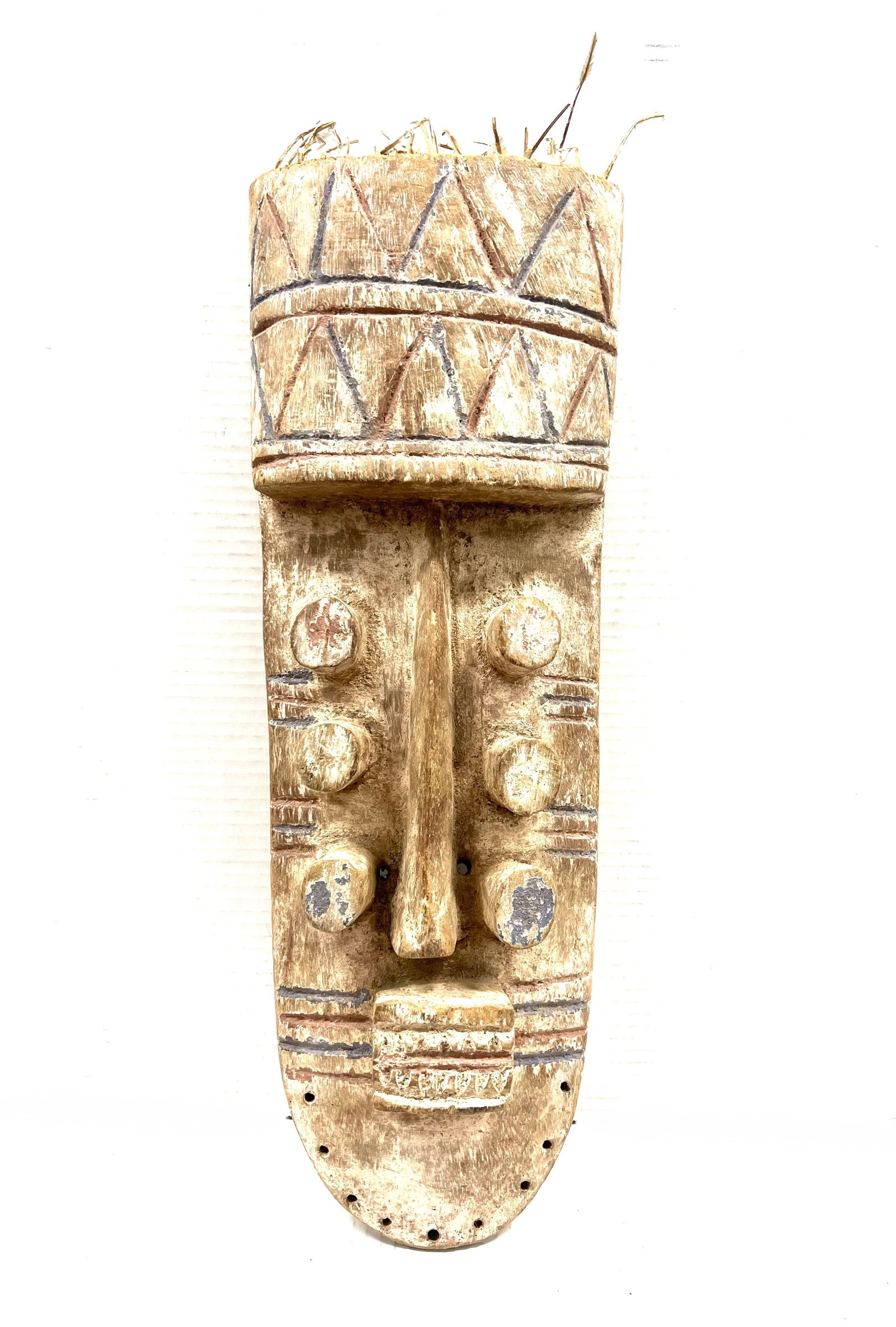 Grebo Mask: African Tribal Art Grebo Mask. The dimension is 23.5 inches high x 8.5 inches wide. Please be aware that some of the items are vintage, secondhand, old ages, antiques and may have a defects or sign of
