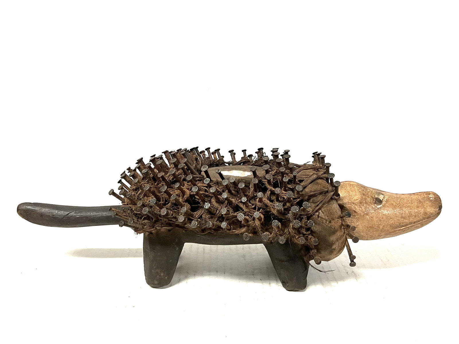 Double Head Dog Nail Fetish: African Tribal Art Double Head Dog Nail Fetish. The dimension is 4.5 inches high x 14.5 inches wide. Please be aware that some of the items are vintage, secondhand, old ages, antiques and may have a
