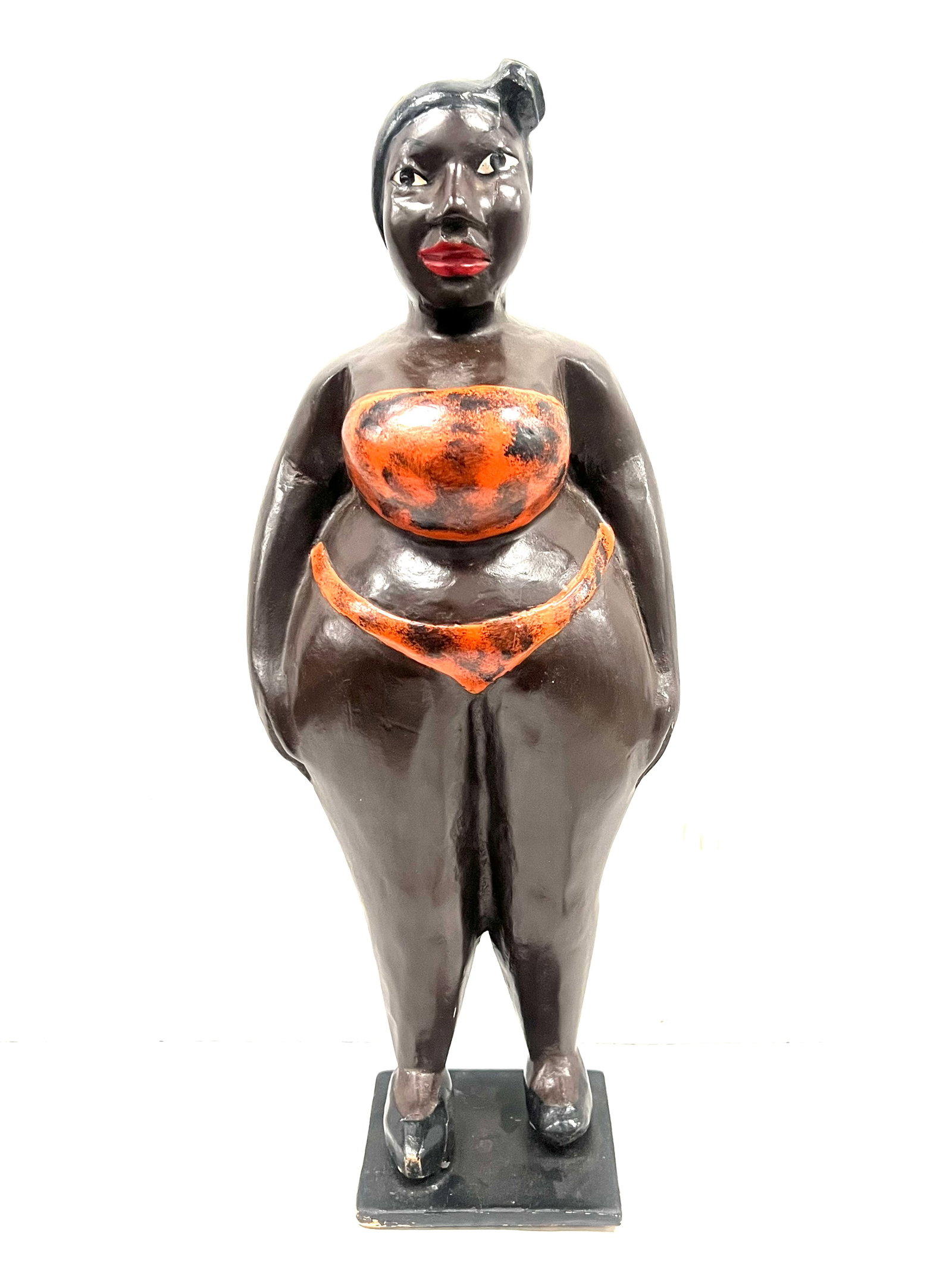 Female Colonial Statue: African Tribal Art Female Colonial Statue. The dimension is 17 inches high x 7 inches wide. Please be aware that some of the items are vintage, secondhand, old ages, antiques and may have a defects
