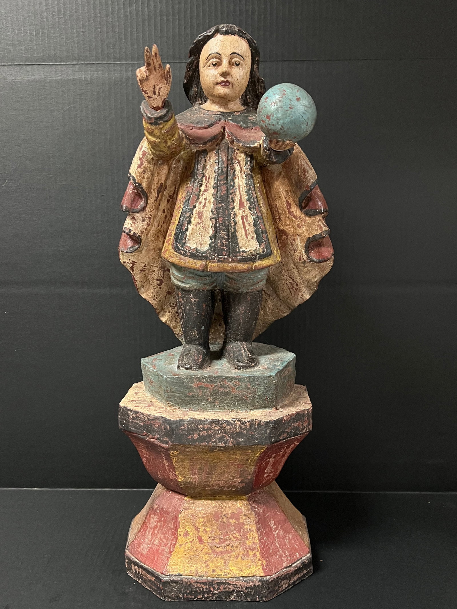 Carved Wood Santo Nino: Religious Art Carved Wood Santo Nino. The dimension is 24 inches high x 9 inches wide. Please be aware that some of the items are vintage, secondhand, old ages, antiques and may have a defects or sign