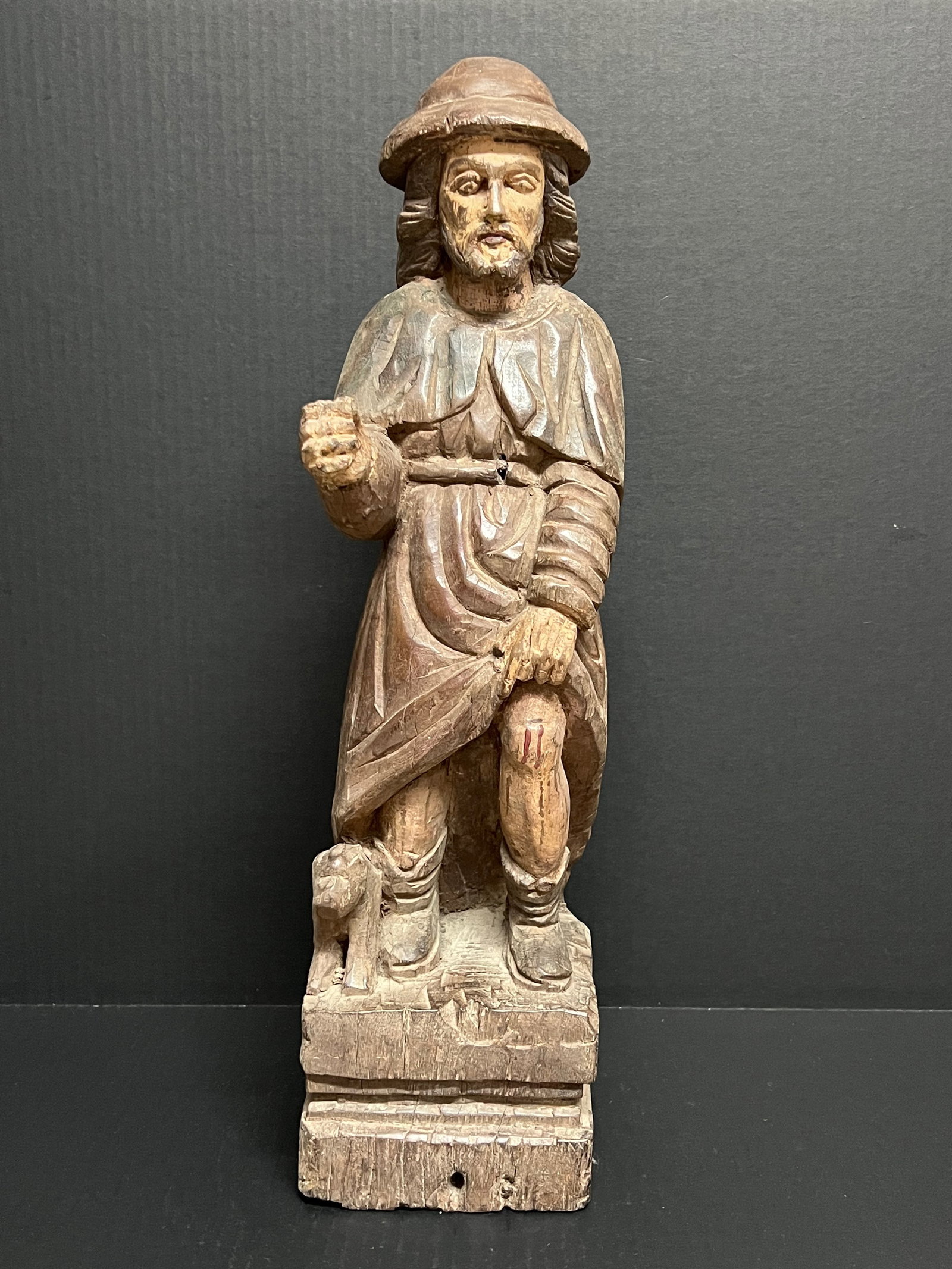Carved Wood Saint Roch Sculpture: Religious Art Carved Wood Saint Roch Sculpture. The dimension is 21 inches high x 7 inches depth x 6 inches wide. Please be aware that some of the items are vintage, secondhand, old ages, antiques and