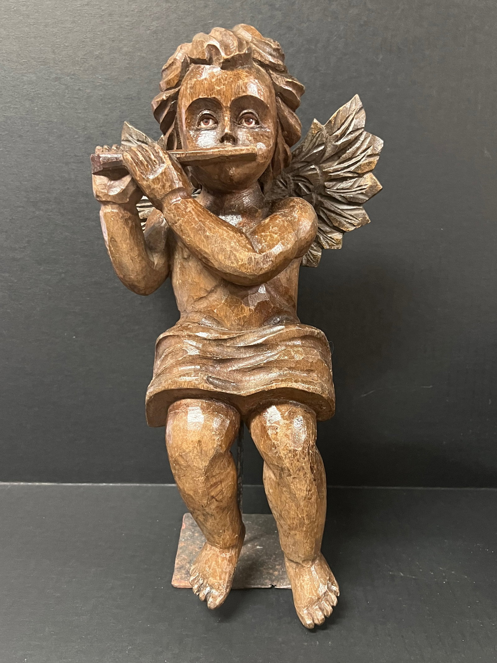 Carved Wood Angel Playing Flute with Stand: Religious Art Carved Wood Angel Playing Flute with stand. The dimension is 15.5 inches high x 7 inches depth x 9 inches wide. Please be aware that some of the items are vintage, secondhand, old ages, 