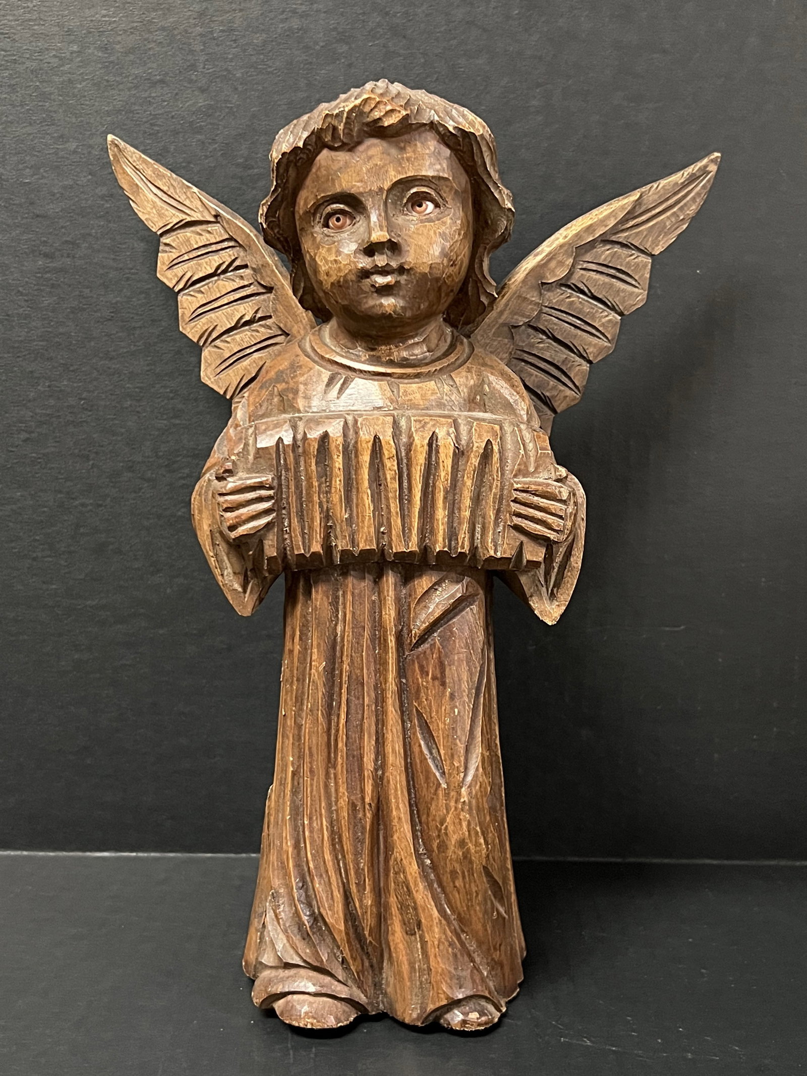 Carved Wood Angel Playing Accordion: Religious Art Carved Wood Angel Playing Accordion. The dimension is 12 inches high x 9 inches wide. Please be aware that some of the items are vintage, secondhand, old ages, antiques and may have a de