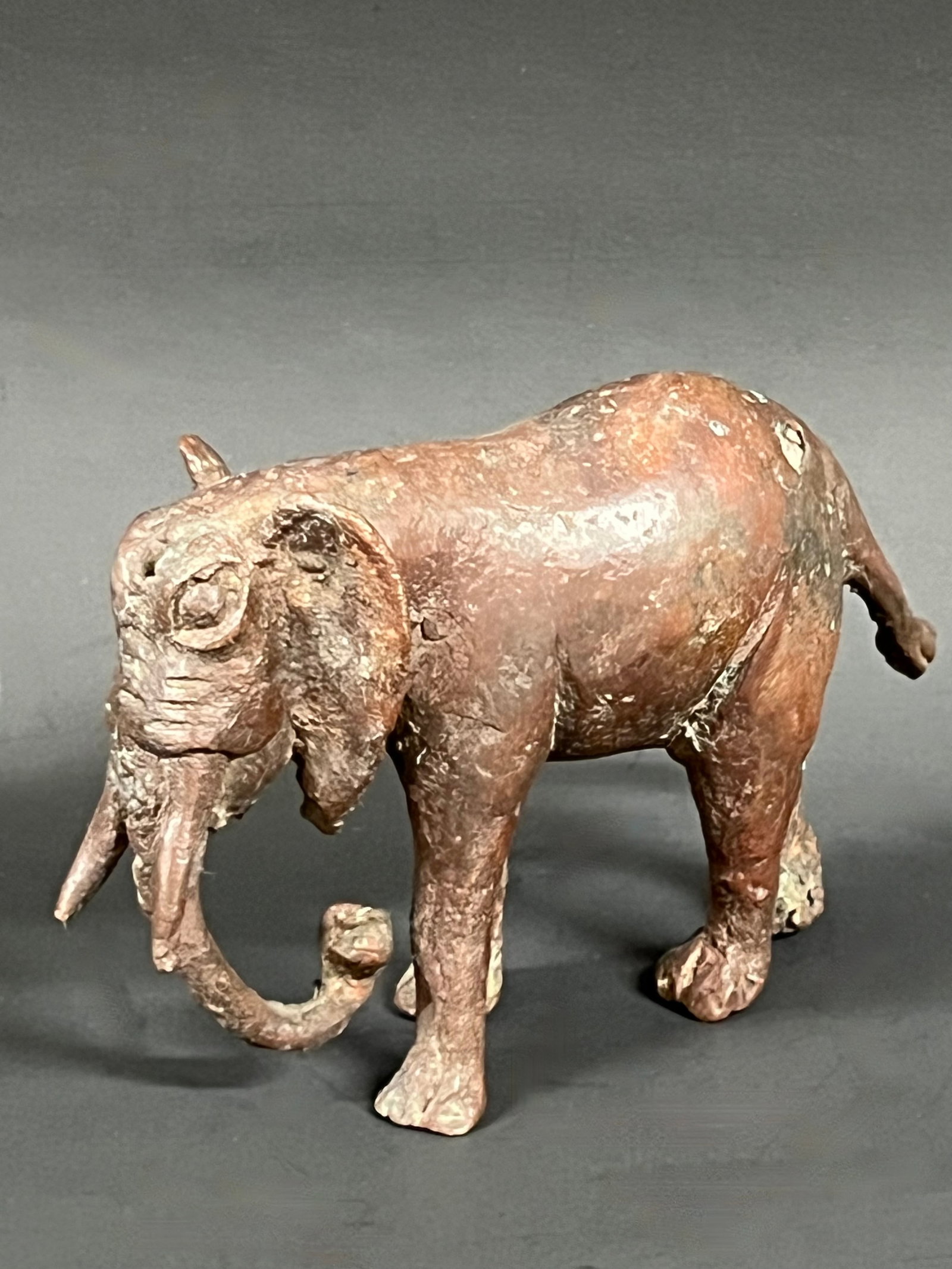 Bronze Elephant Sculpture: African Tribal Art Bronze Elephant Sculpture. The dimension is 3.25 inches high x 1.5 inches depth x 5.25 inches wide. Please be aware that some of the items are vintage, secondhand, old ages,