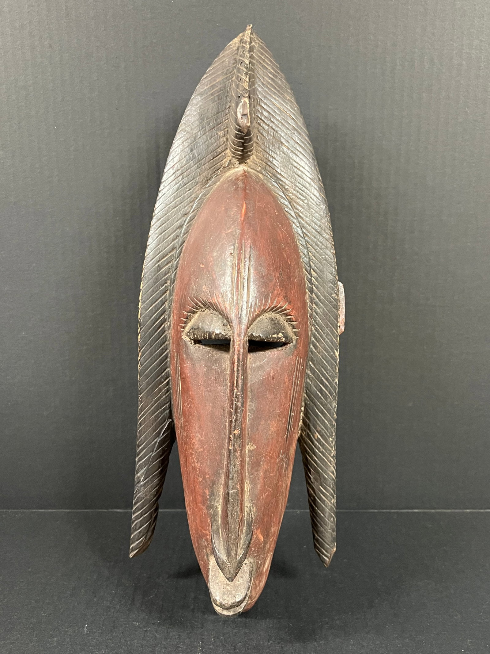 Bamana Mask: African Tribal Art Bamana Mask. The dimension is 17 inches high x 6.5 inches wide. Please be aware that some of the items are vintage, secondhand, old ages, antiques and may have a defects or sign of