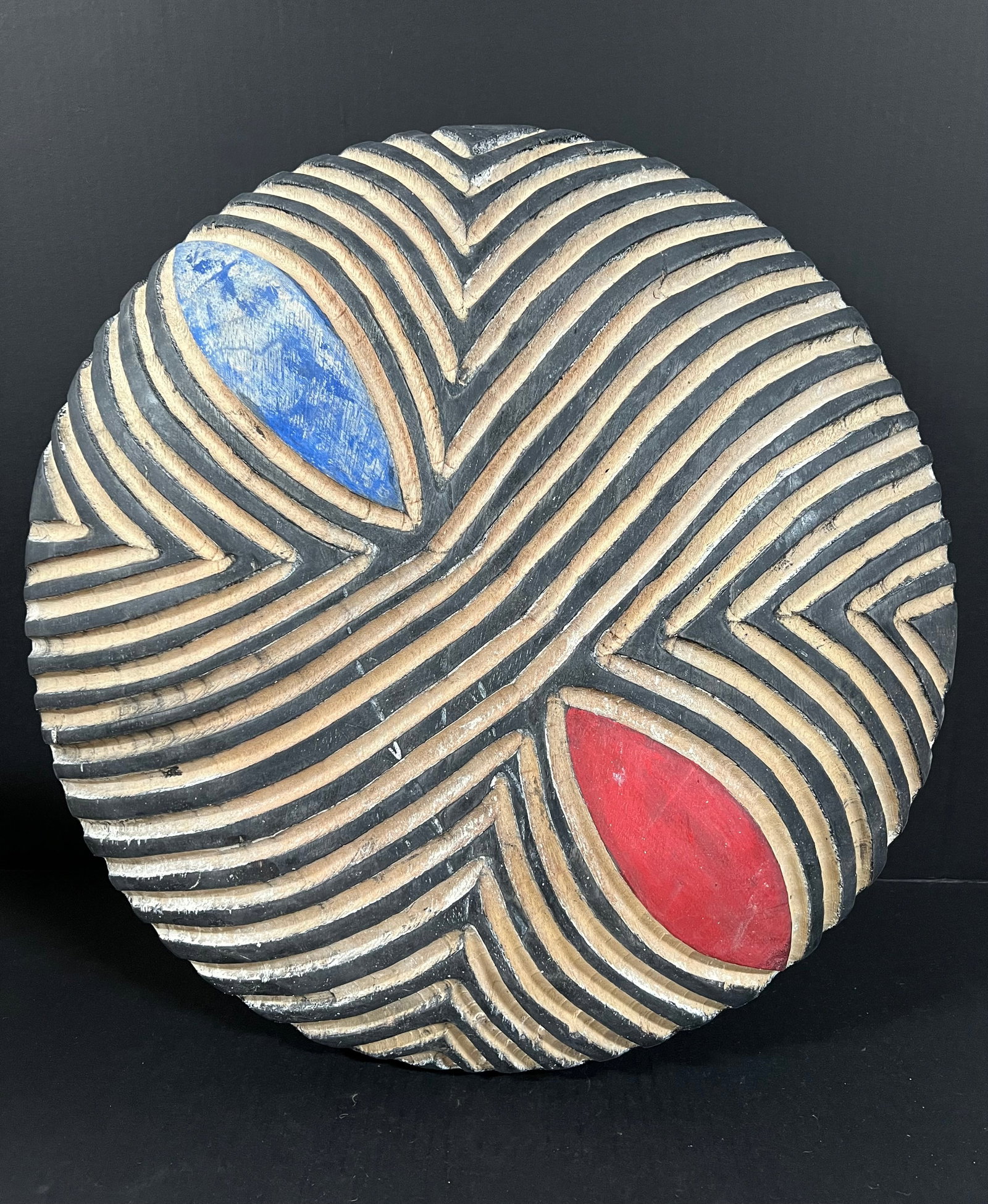 Zulu Shield: African Tribal Art Zulu Shield. The dimension is 20.5 inches high x 20.5 inches wide. Please be aware that some of the items are vintage, secondhand, old ages, antiques and may have a defects or sign