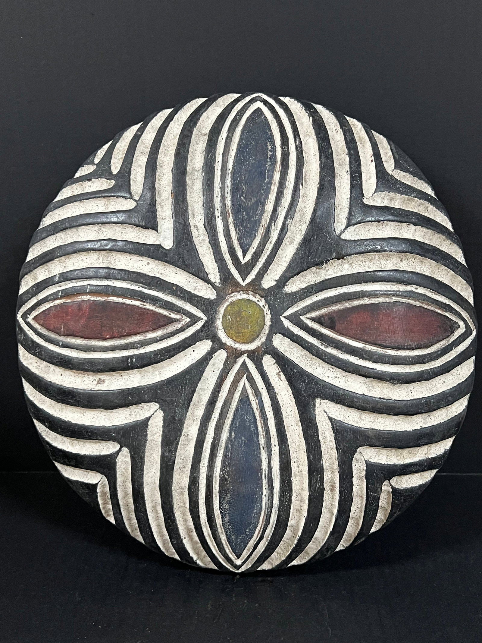 Zulu Shield: African Tribal Art Zulu Shield. The dimension is 13.5 inches high x 13.5 inches wide. Please be aware that some of the items are vintage, secondhand, old ages, antiques and may have a defects or sign 