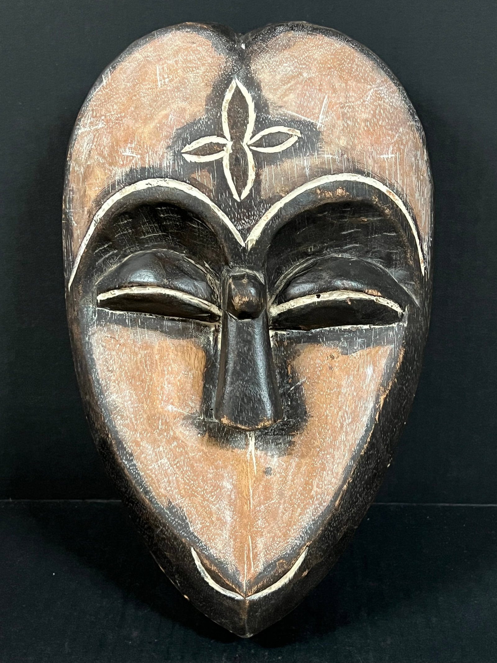 Kwele Mask: African Tribal Art Kwele Mask. The dimension is 14 inches high x 9 inches wide. Please be aware that some of the items are vintage, secondhand, old ages, antiques and may have a defects or sign of