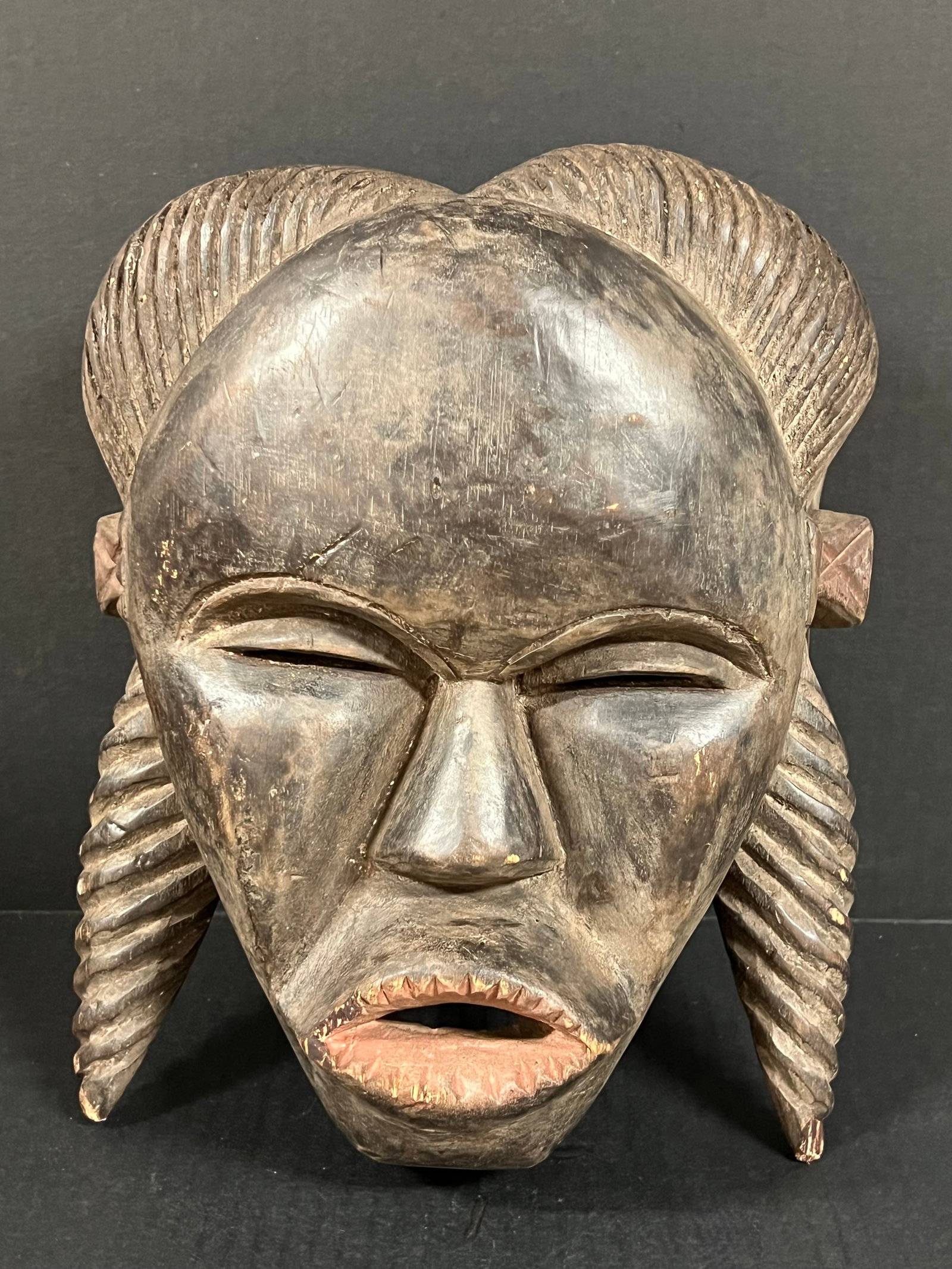 Makonde Mask: African Tribal Art Makonde Mask. The dimension is 12 inches high x 9.5 inches wide. Please be aware that some of the items are vintage, secondhand, old ages, antiques and may have a defects or sign