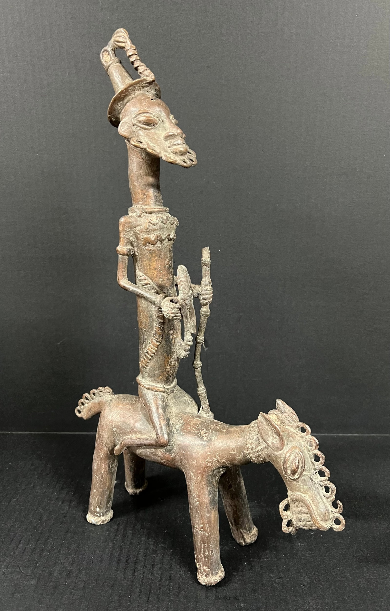 Benin Bronze Warrior with Horse: African Tribal Art Benin Bronze Warrior with Horse. The dimension is 18 inches high x 3 inches depth x 11.5 inches wide. Please be aware that some of the items are vintage, secondhand, old ages,