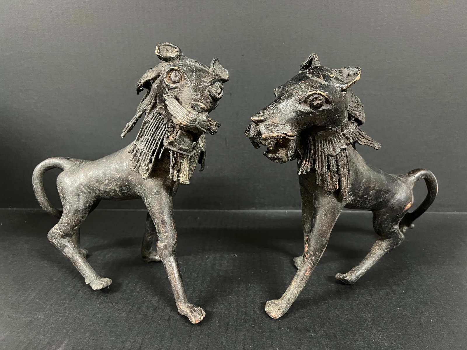 Pair of Bronze Tiger Sculpture: African Tribal Art Pair of Bronze Tiger Sculpture. The dimension is 9.75 inches high x 4.5 inches depth x 9 inches wide and 9.5 inches high x 3 inches depth x 9 inches wide. Please be aware that some 