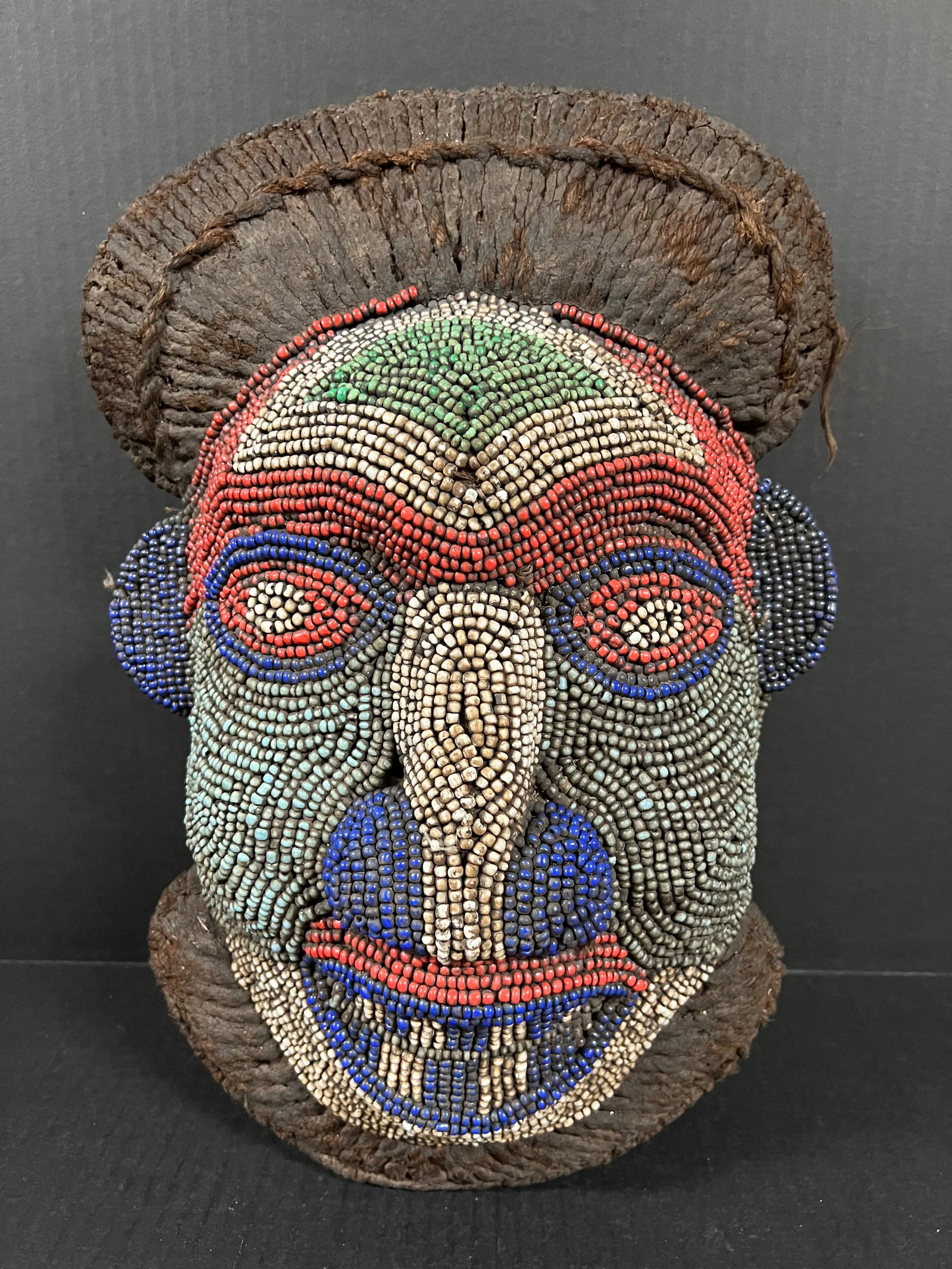 Bamileke Beaded Mask: African Tribal Art Bamileke Beaded Mask. The dimension is 16.5 inches high x 11.5 inches wide. Please be aware that some of the items are vintage, secondhand, old ages, antiques and may have a defects