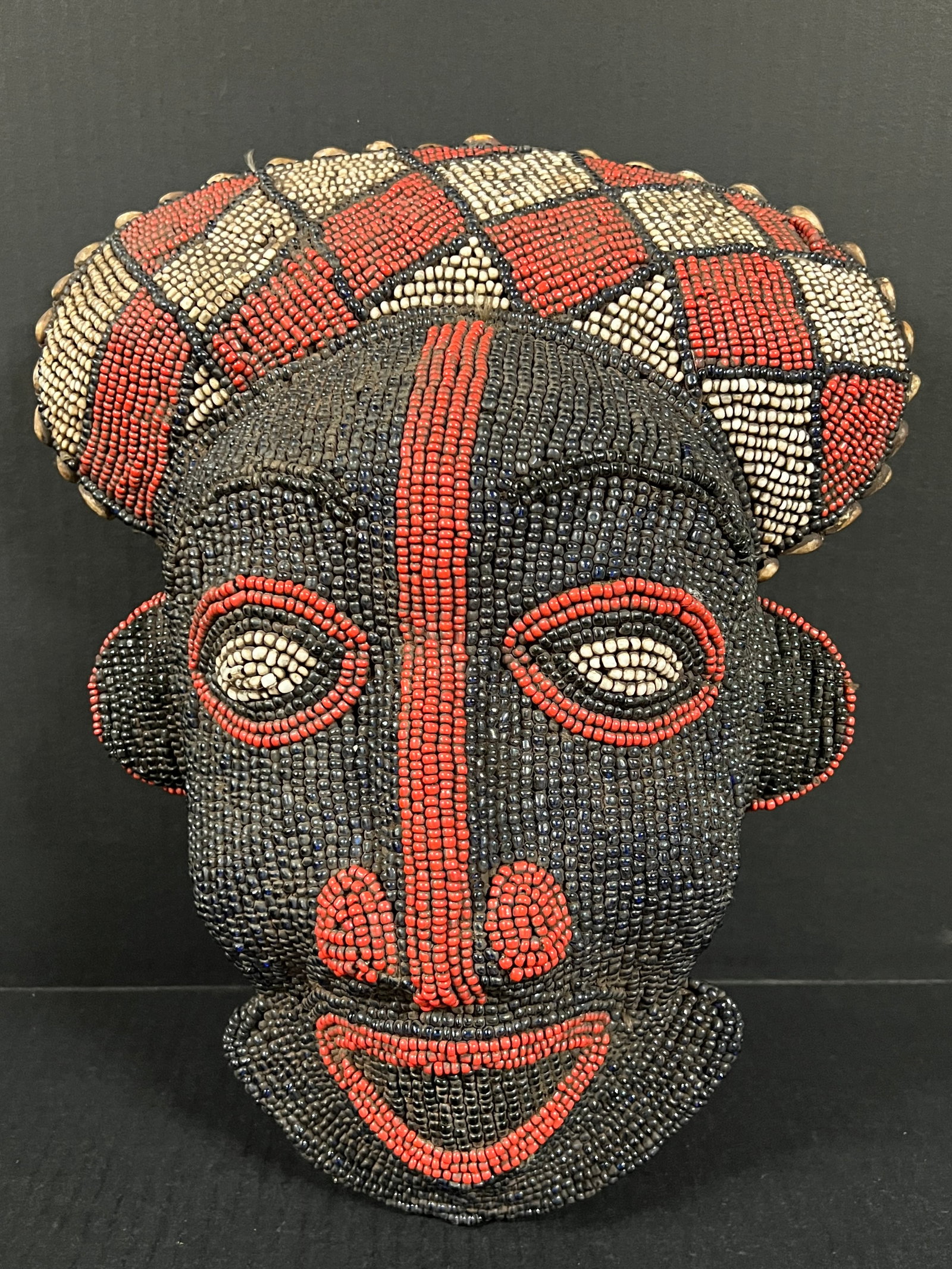 Bamileke Beaded Mask: African Tribal Art Bamileke Beaded Mask. The dimension is 15.5 inches high x 12.5 inches wide. Please be aware that some of the items are vintage, secondhand, old ages, antiques and may have a defects
