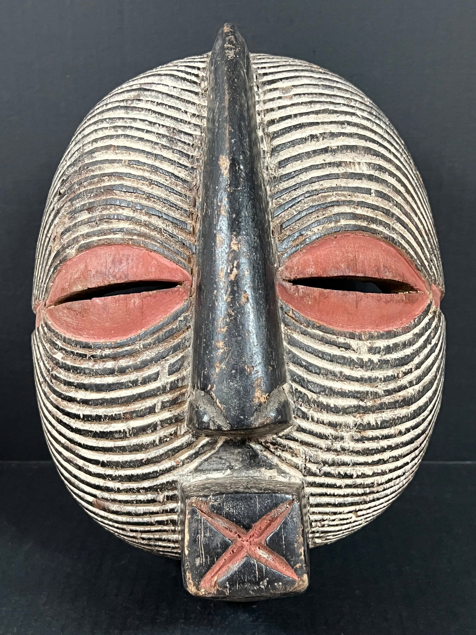 Basonge Mask: African Tribal Art Basonge Mask. The dimension is 13 inches high x 10 inches wide. Please be aware that some of the items are vintage, secondhand, old ages, antiques and may have a defects or sign of