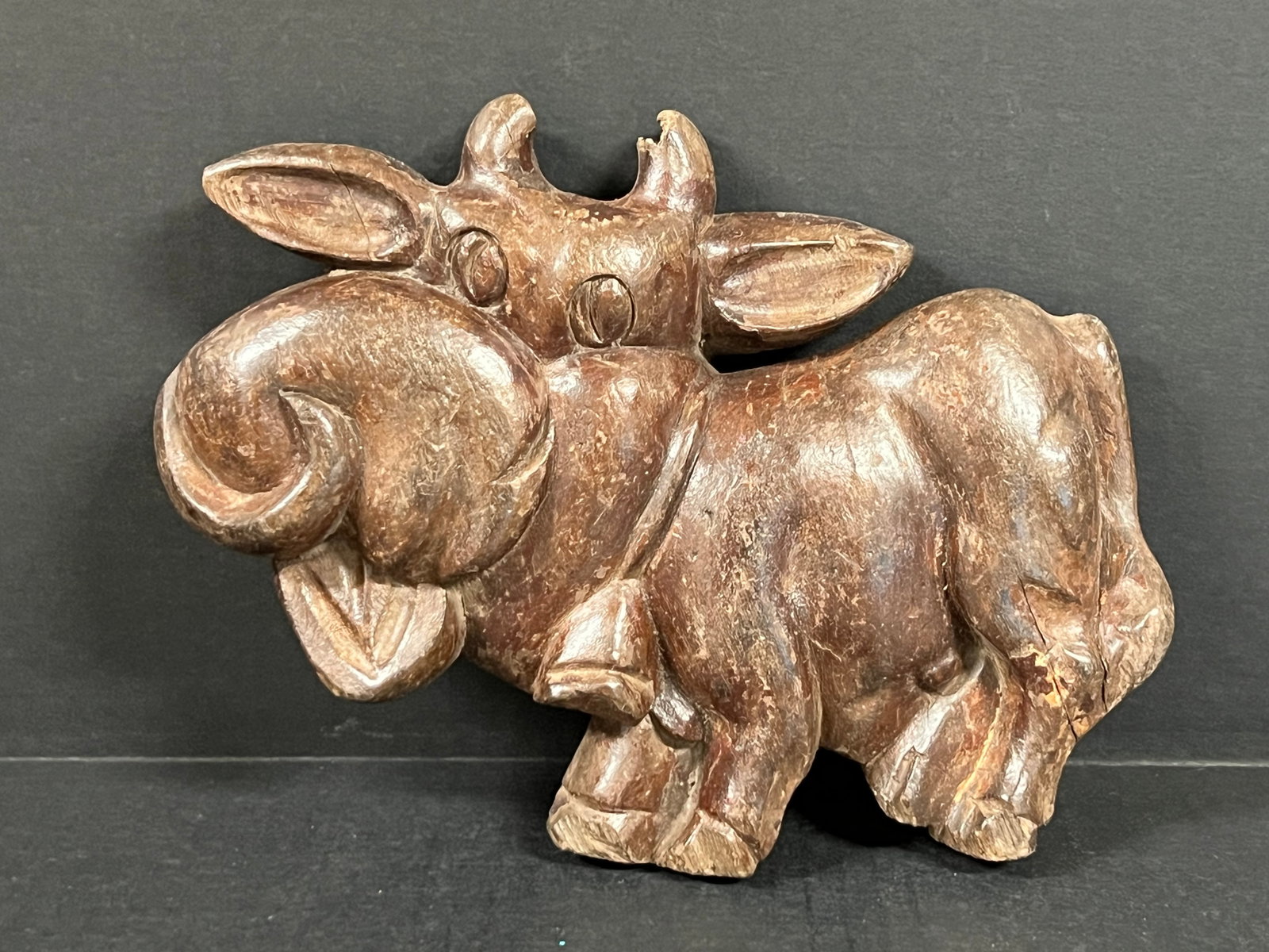 Carved Wood Cow Plaque: Folk Art Carved Wood Cow Plaque. The dimension is 7 inches high x 9.75 inches wide. Please be aware that some of the items are vintage, secondhand, old ages, antiques and may have a defects or sign of