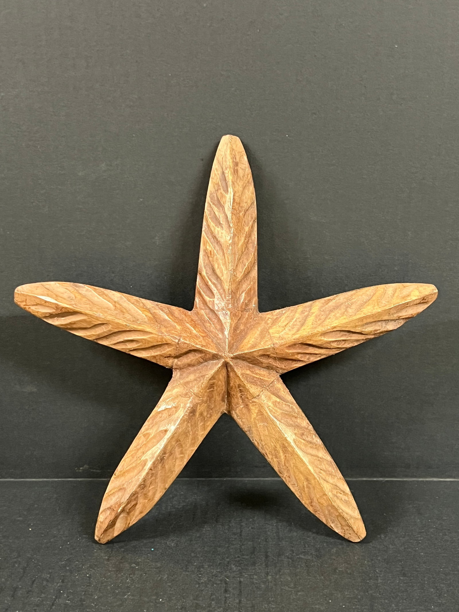 Carved Wood Starfish: Folk Art Carved Wood Starfish. The dimension is 10 inches high x 10.75 inches wide. Please be aware that some of the items are vintage, secondhand, old ages, antiques and may have a defects or sign of