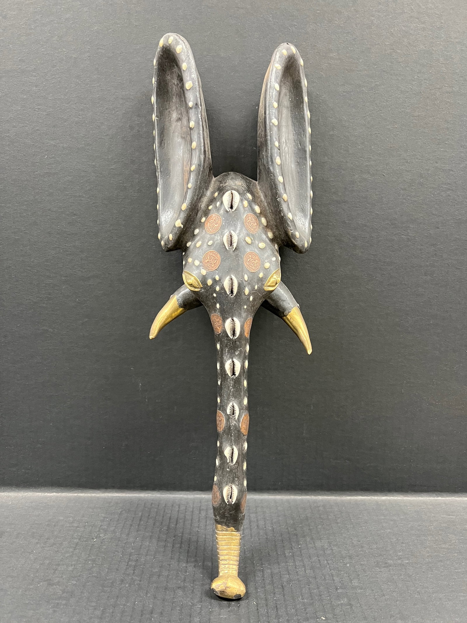 Carved Wood Elephant Mask: African Tribal Art Carved Wood Elephant Mask. The dimension is 20.25 inches high x 7.25 inches wide. Please be aware that some of the items are vintage, secondhand, old ages, antiques and may have a d