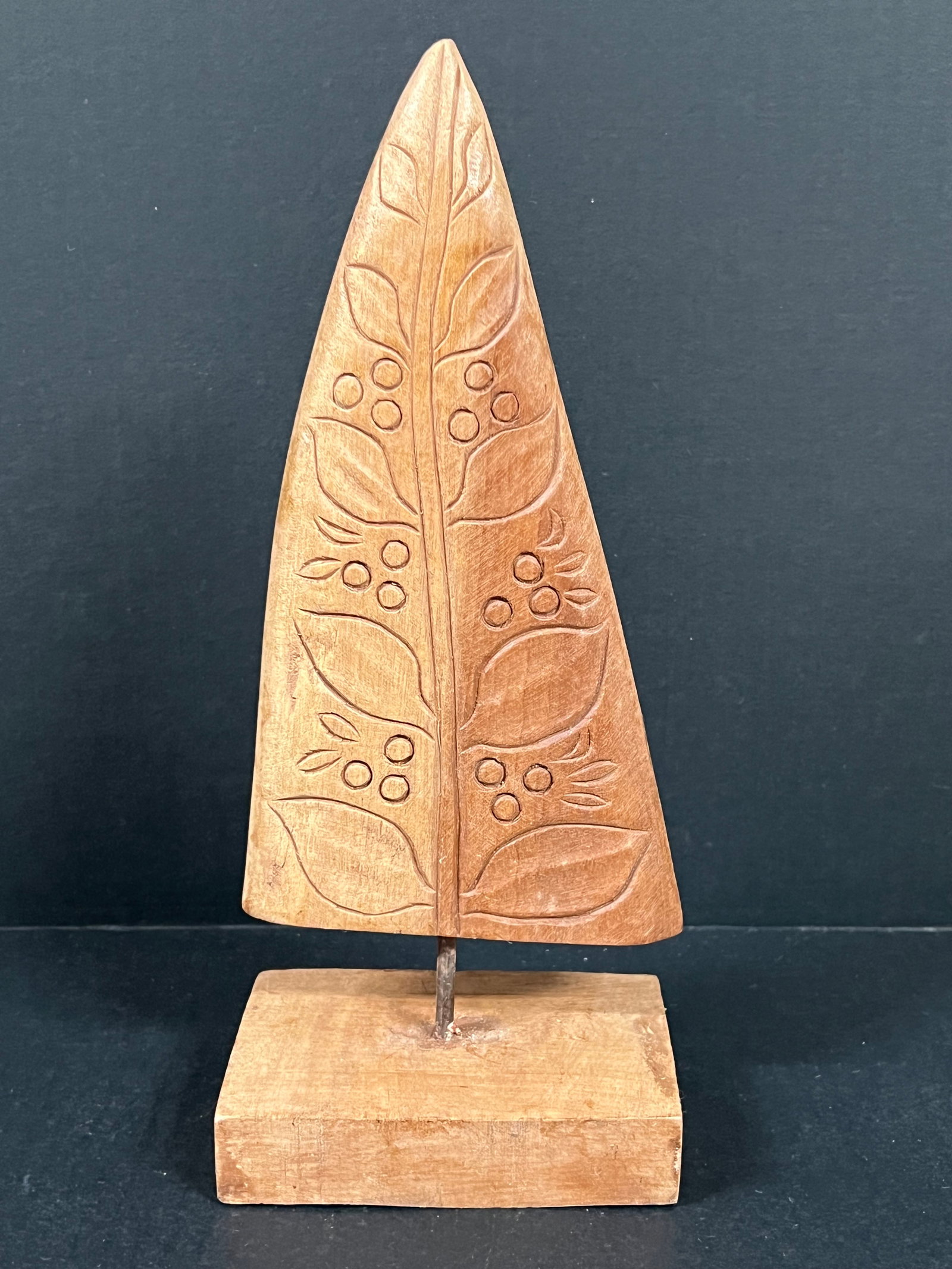Carved Wood Christmas Tree: Folk Art Carved Wood Christmas Tree. The dimension is 12 inches high x 3.5 inches depth x 5 inches wide. Please be aware that some of the items are vintage, secondhand, old ages, antiques and may have
