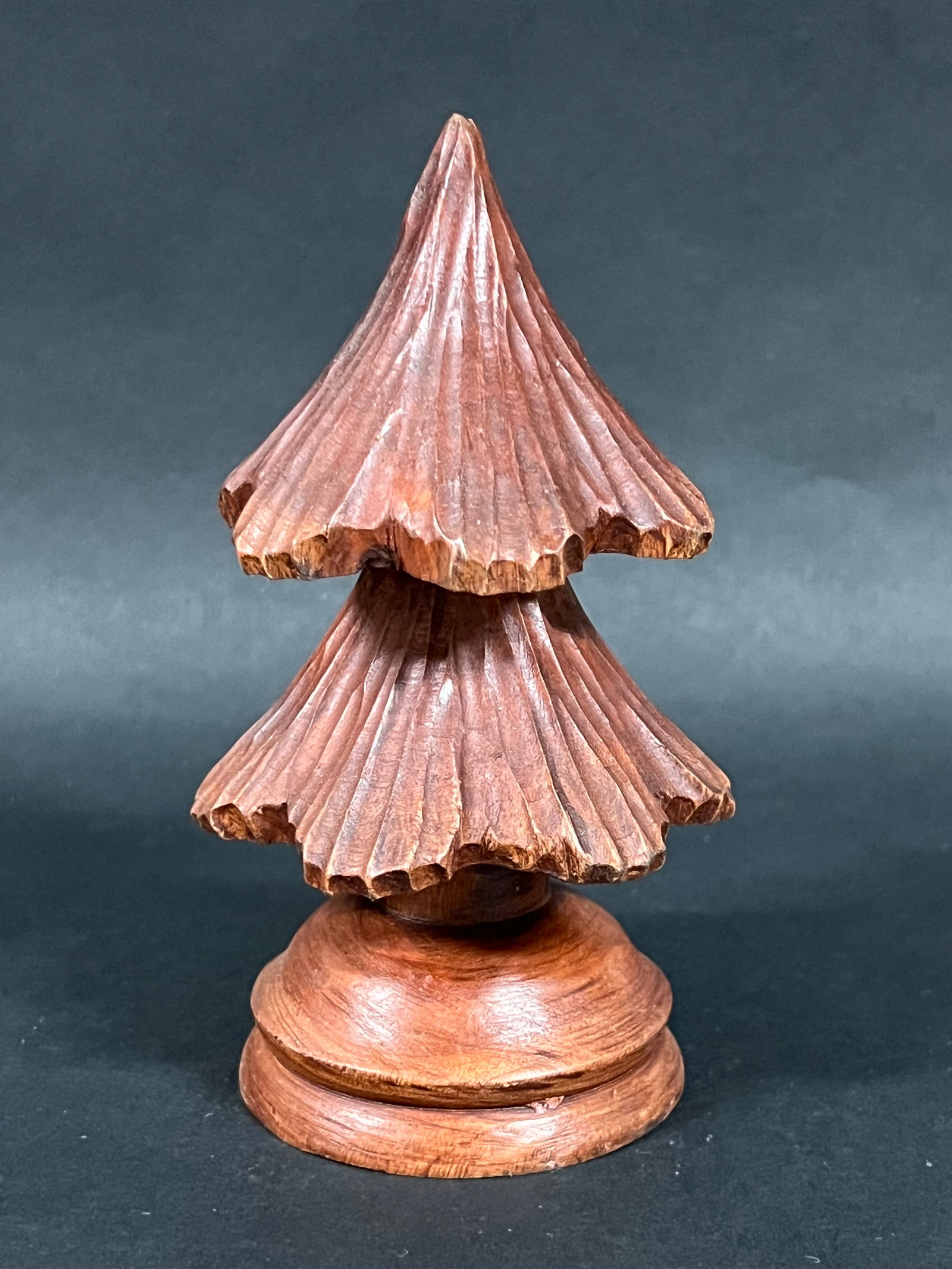 Carved Wood Christmas Tree: Folk Art Carved Wood Christmas Tree. The dimension is 6 inches high x 3.5 inches wide. Please be aware that some of the items are vintage, secondhand, old ages, antiques and may have a defects or sign