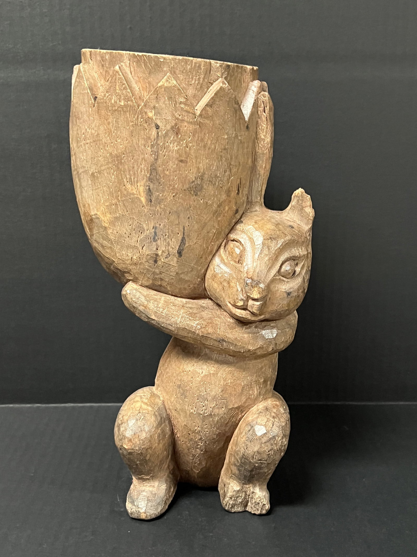 Carved Wood Rabbit Sculpture: Folk Art Carved Wood Rabbit Sculpture. The dimension is 8.5 inches high x 5.5 inches wide. Please be aware that some of the items are vintage, secondhand, old ages, antiques and may have a defects or 
