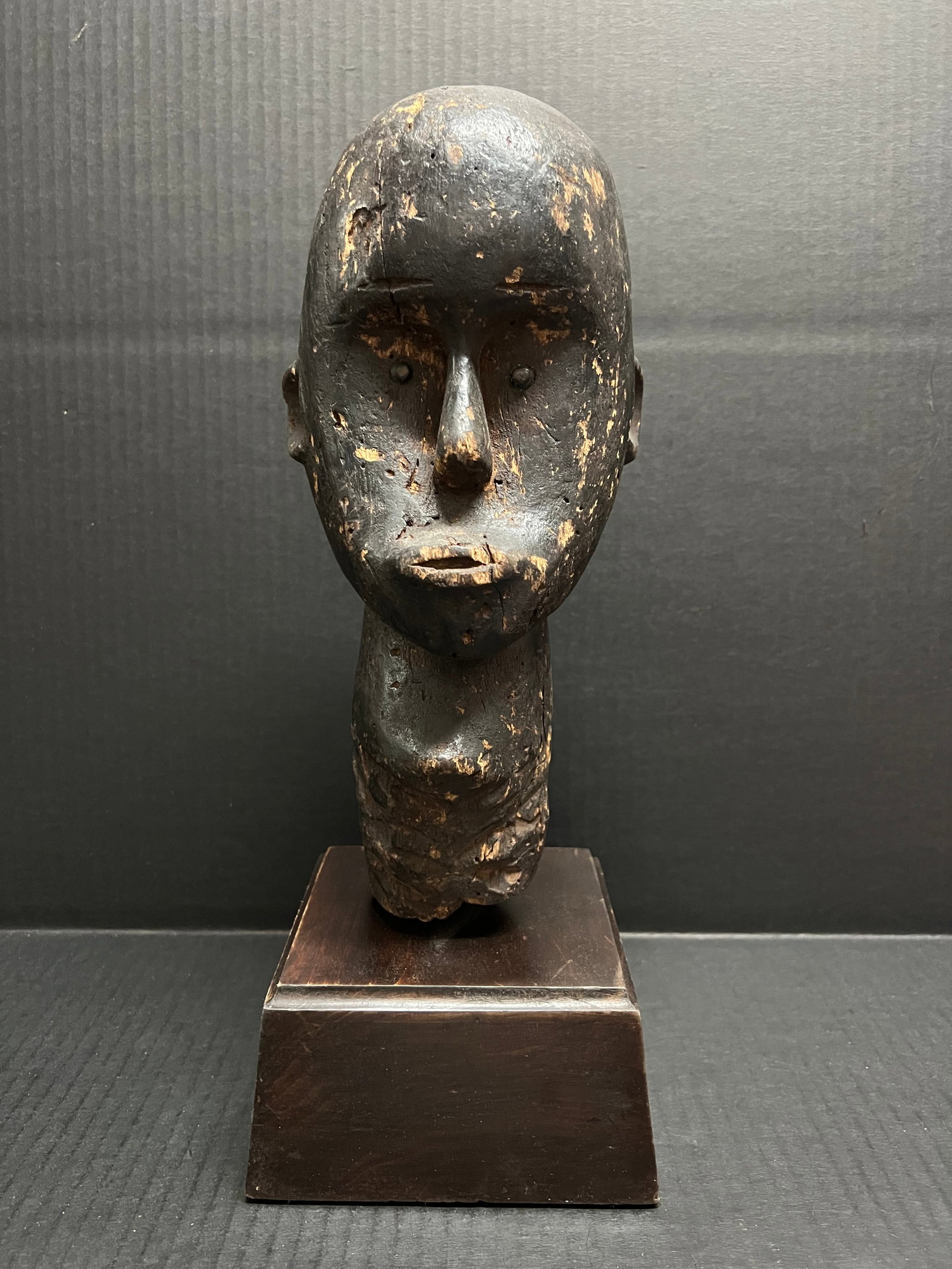Carved Wood Fang Head: African Tribal Art Carved Wood Fang Head. The dimension is 14.5 inches high x 5.5 inches wide. Please be aware that some of the items are vintage, secondhand, old ages, antiques and may have a