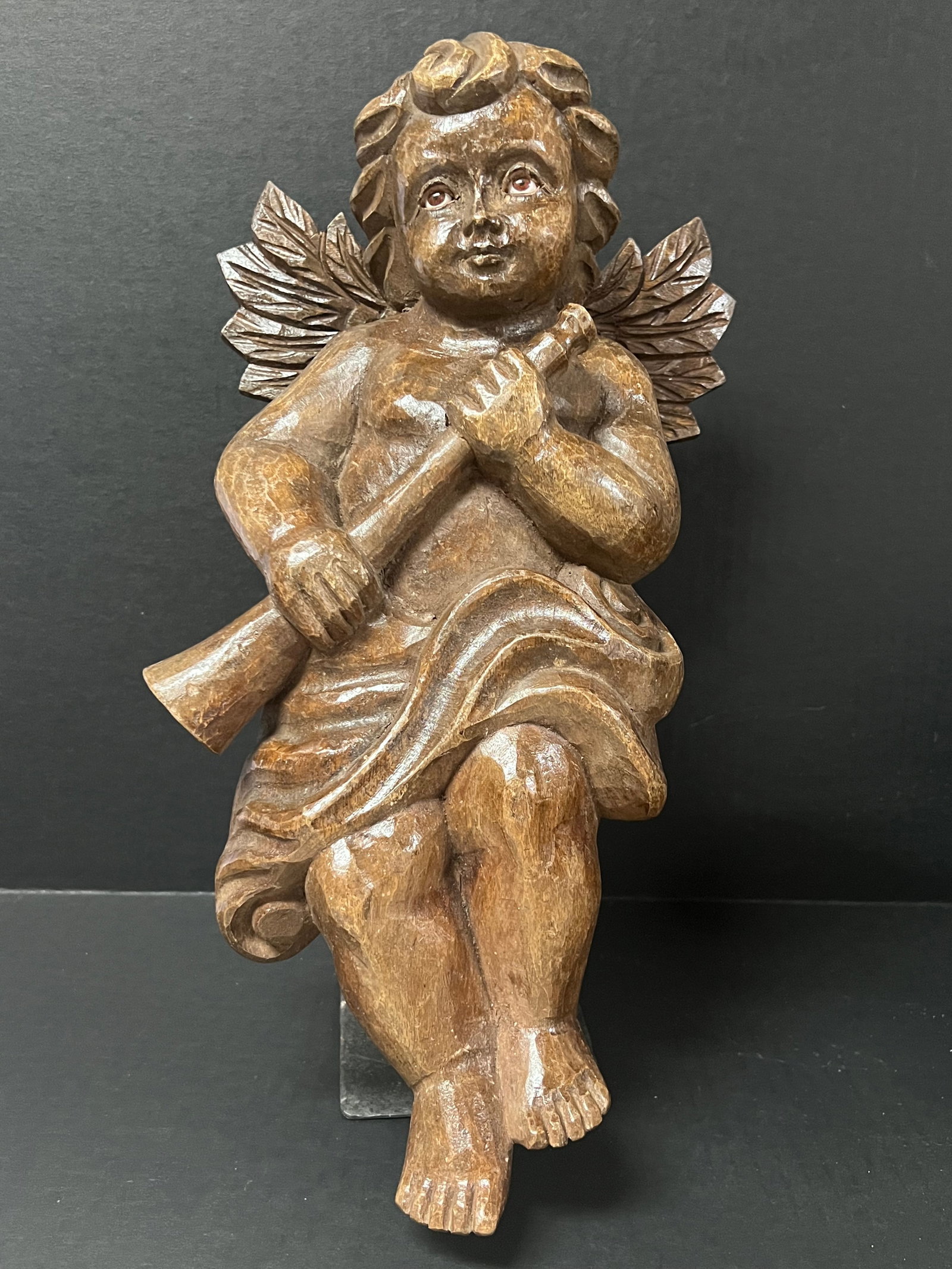 Carved Wood Angel Playing Trumpet with Stand: Religious Art Carved Wood Cherub. The dimension is 6.5 inches high x 2 inches depth x 8.75 inches wide. Please be aware that some of the items are vintage, secondhand, old ages, antiques and may have 