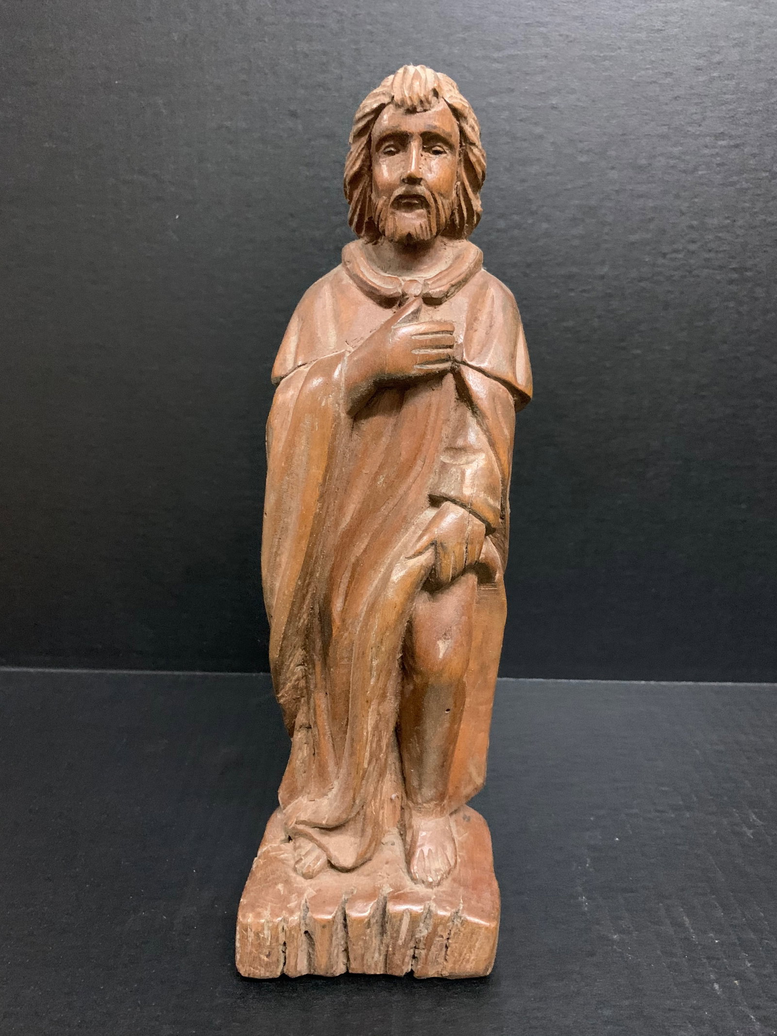 Carved Wood Saint Roch: Religious Art Carved Wood Saint Roch. The dimension is 12.5 inches high x 4 inches wide. Please be aware that some of the items are vintage, secondhand, old ages, antiques and may have a defects or si